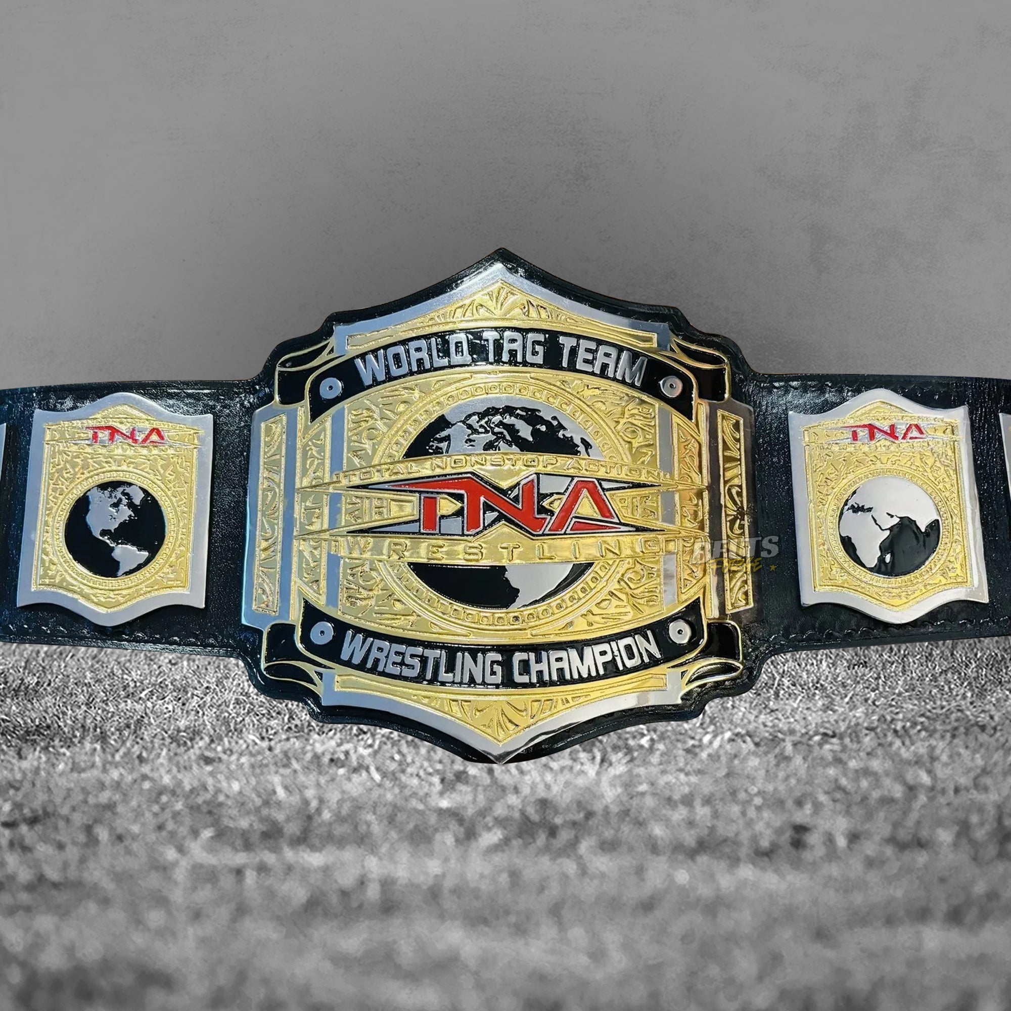 TNA World Tag Team Championship Belt replica full view showing hexagonal main plate with TNA logo and globe engraving