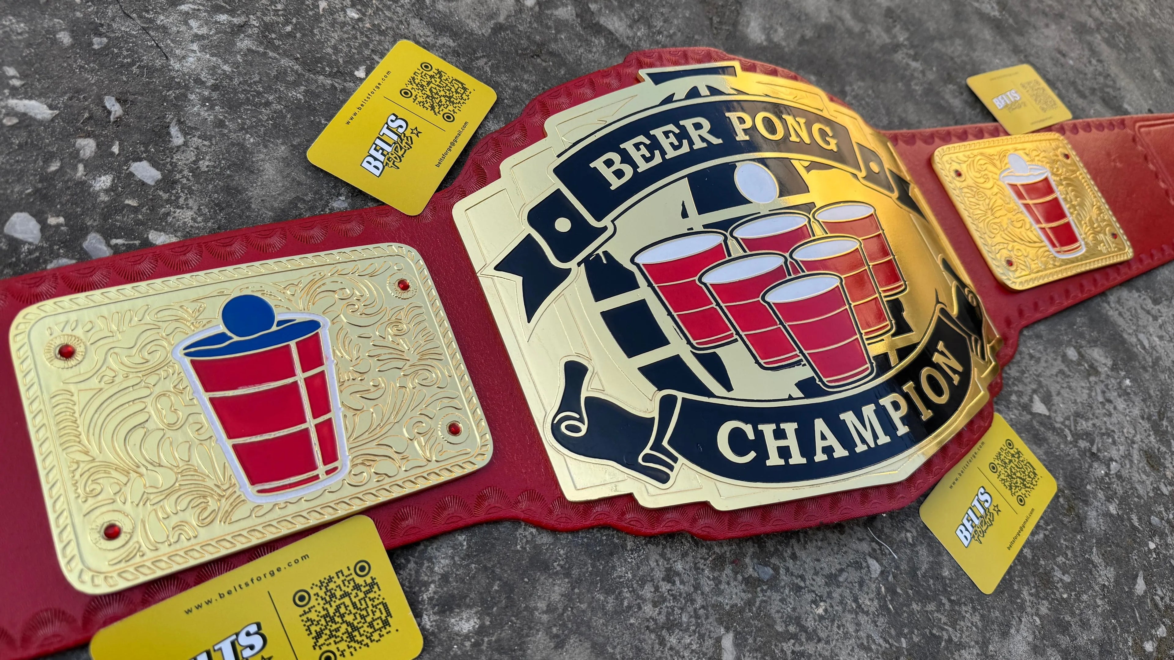 Beer Pong Champion Novelty Belt center plate close-up showing CNC-engraved gold-plated brass Beer Pong Champion design with cup detail