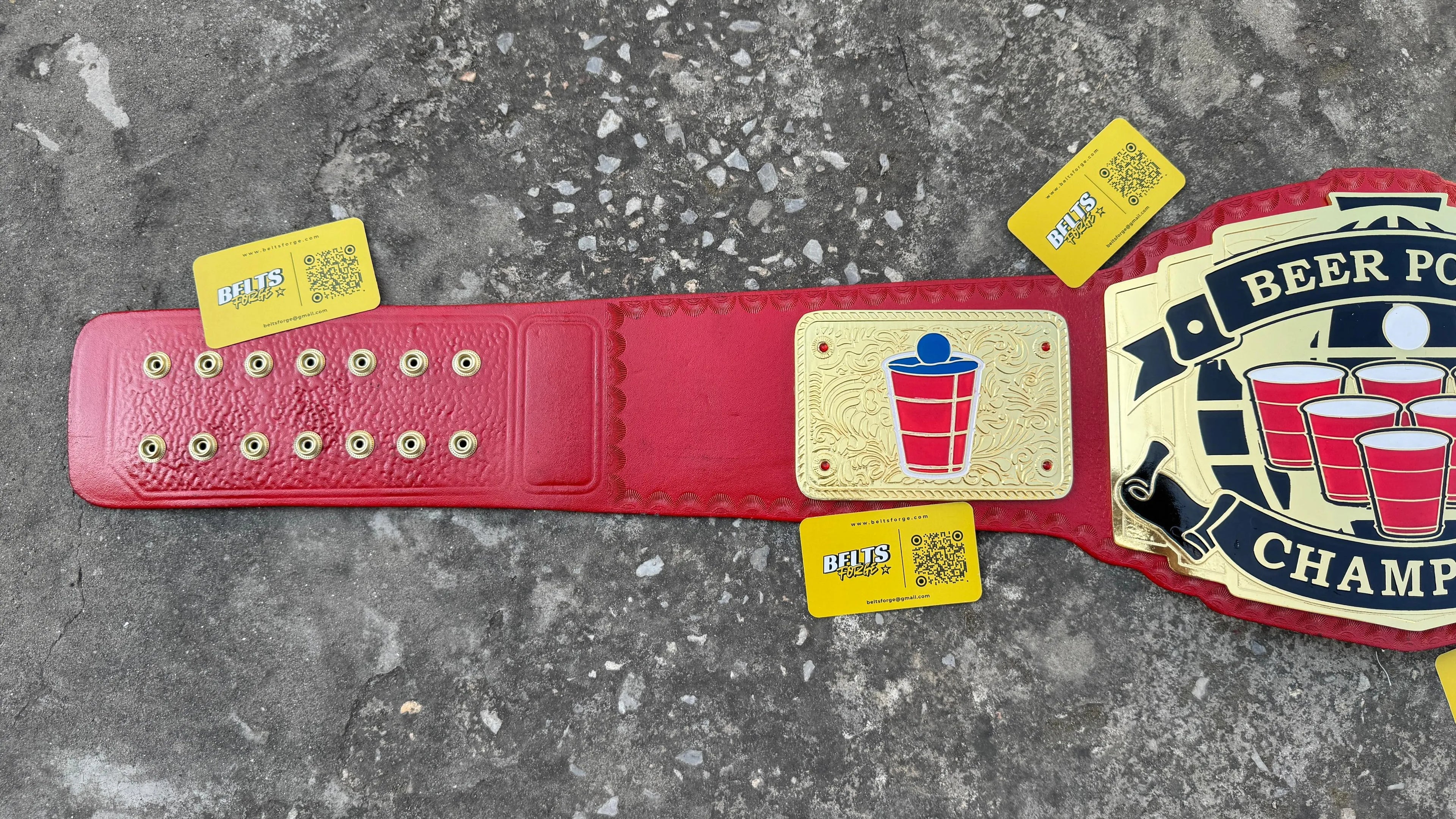 Beer Pong Champion Novelty Belt strap and center plate view showing full gold brass plate arrangement on genuine red leather strap