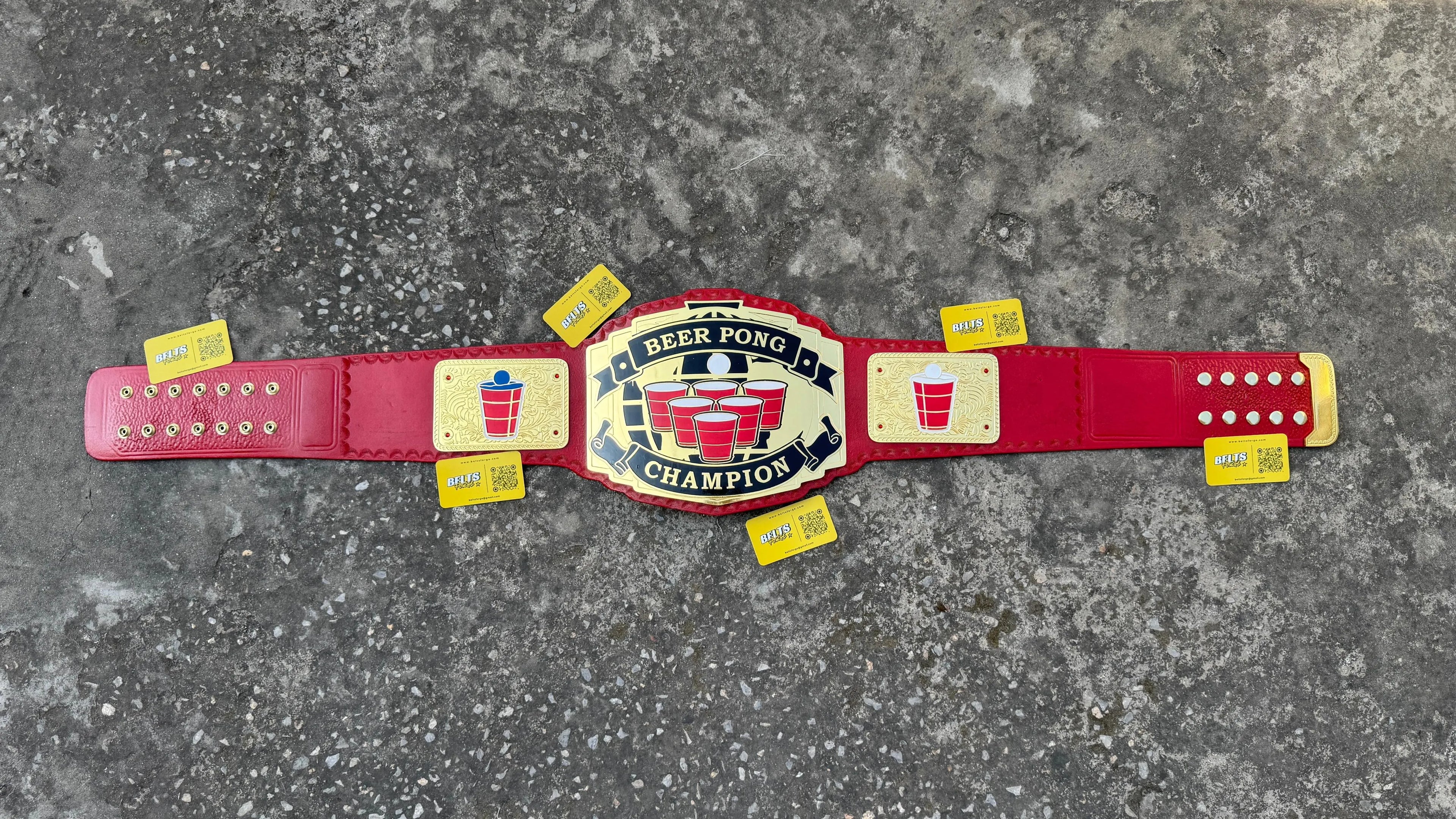 Beer Pong Champion Novelty Belt strap top view showing genuine red leather strap with gold hardware running full length