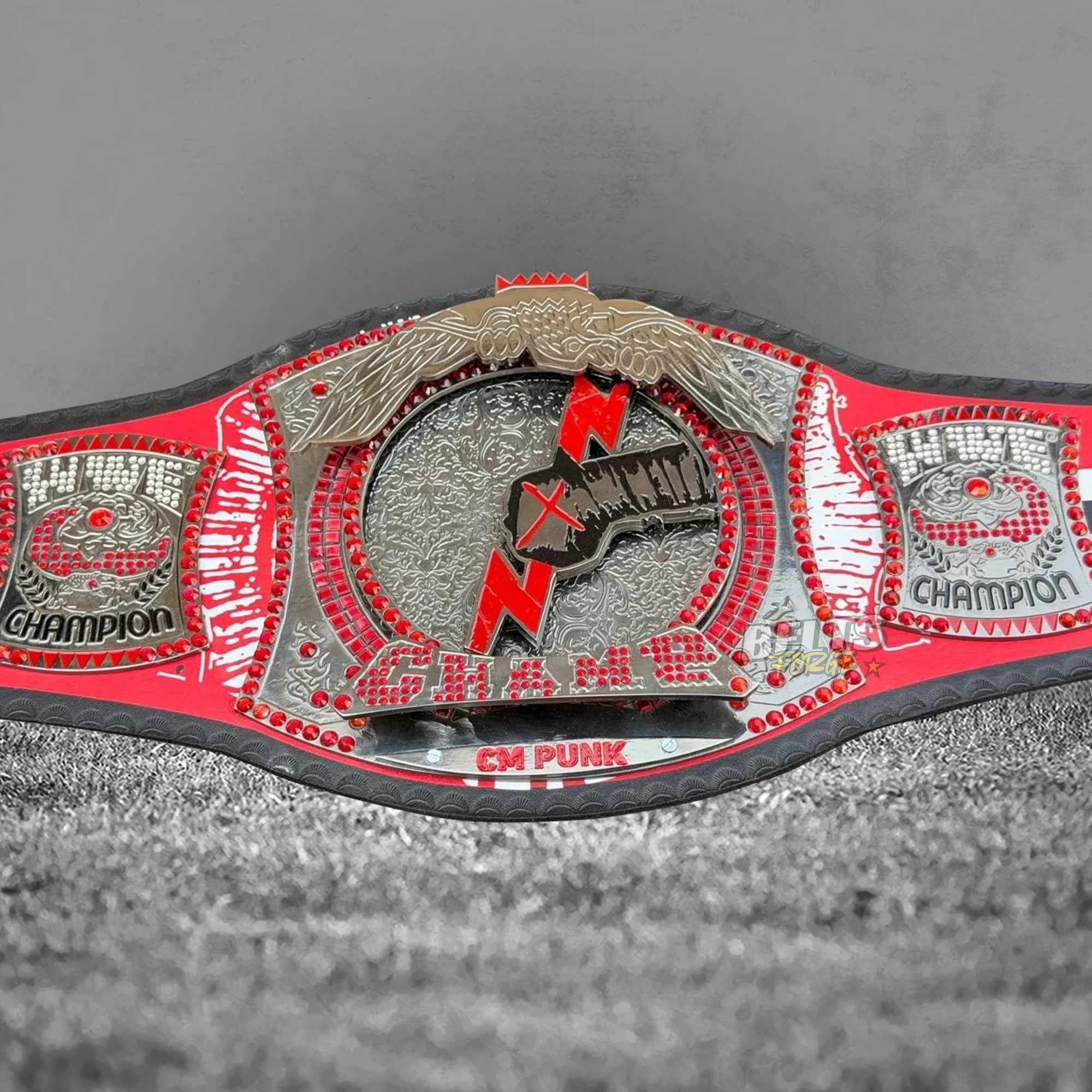 CM Punk Championship Belt angled front view showing center plate and Champion side plates