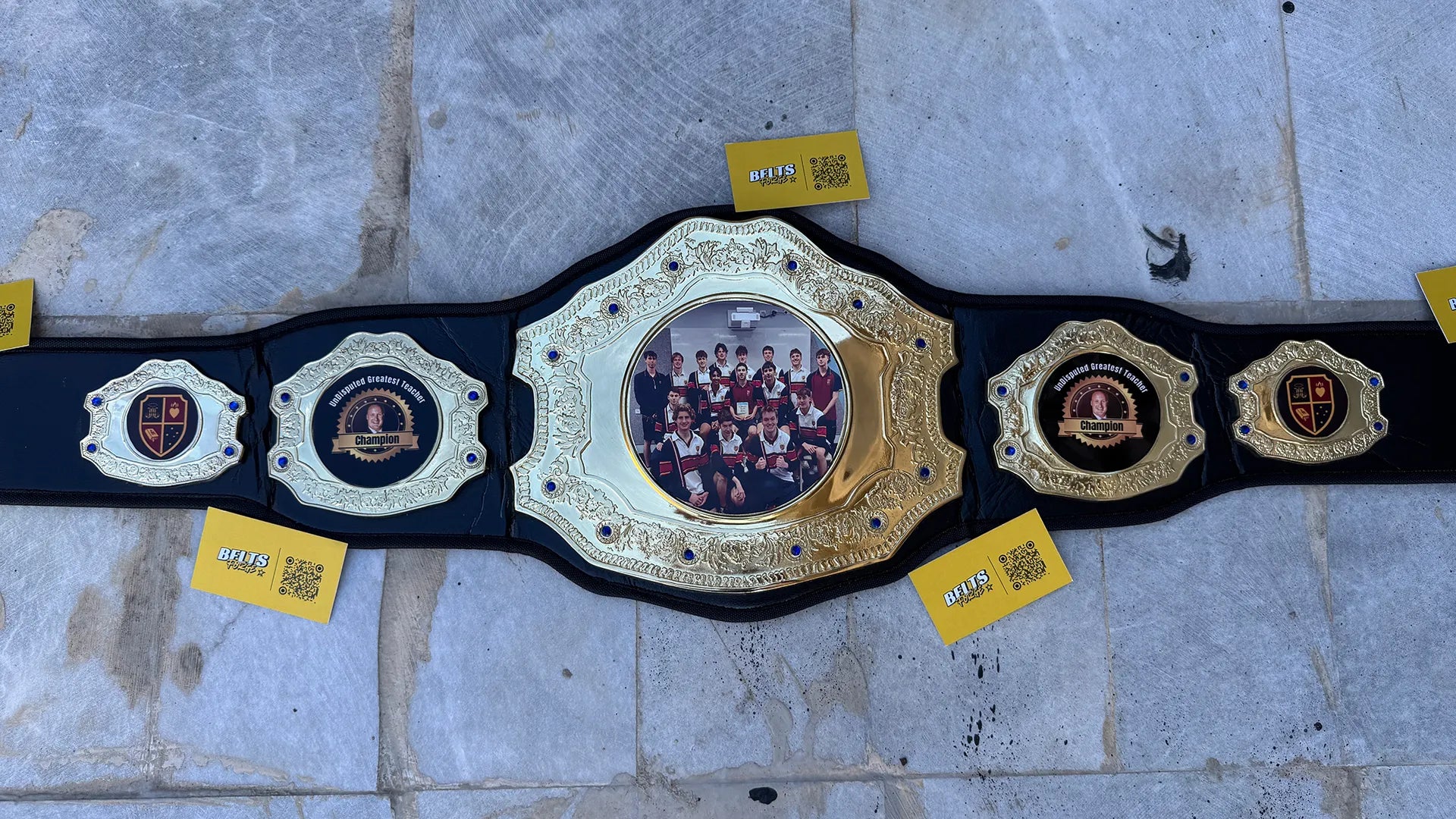 Custom Greatest Teacher Championship Belt full belt gold center plate overhead view