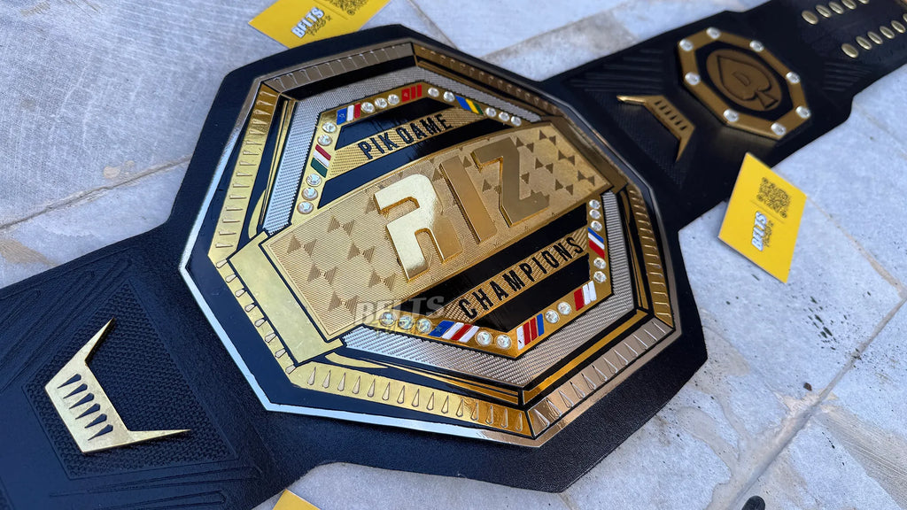Custom UFC style championship belt center plate angled close up showing custom club branding on octagon design