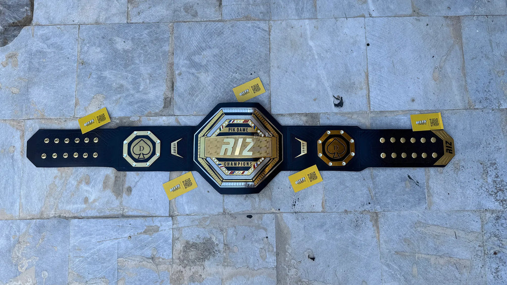 Custom UFC style championship belt full overhead flat lay showing all plates and genuine leather strap