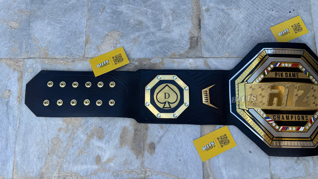 Custom UFC style championship belt left strap showing spade side plate and adjustment holes detail