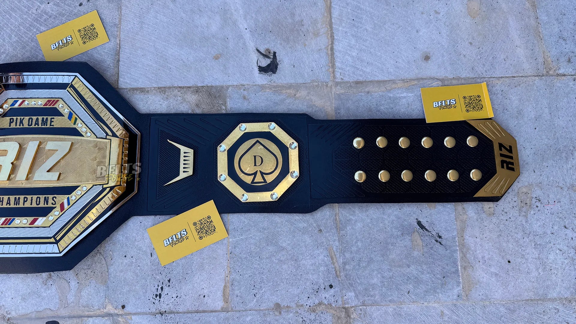 Custom UFC style championship belt right strap showing spade side plate and buckle detail