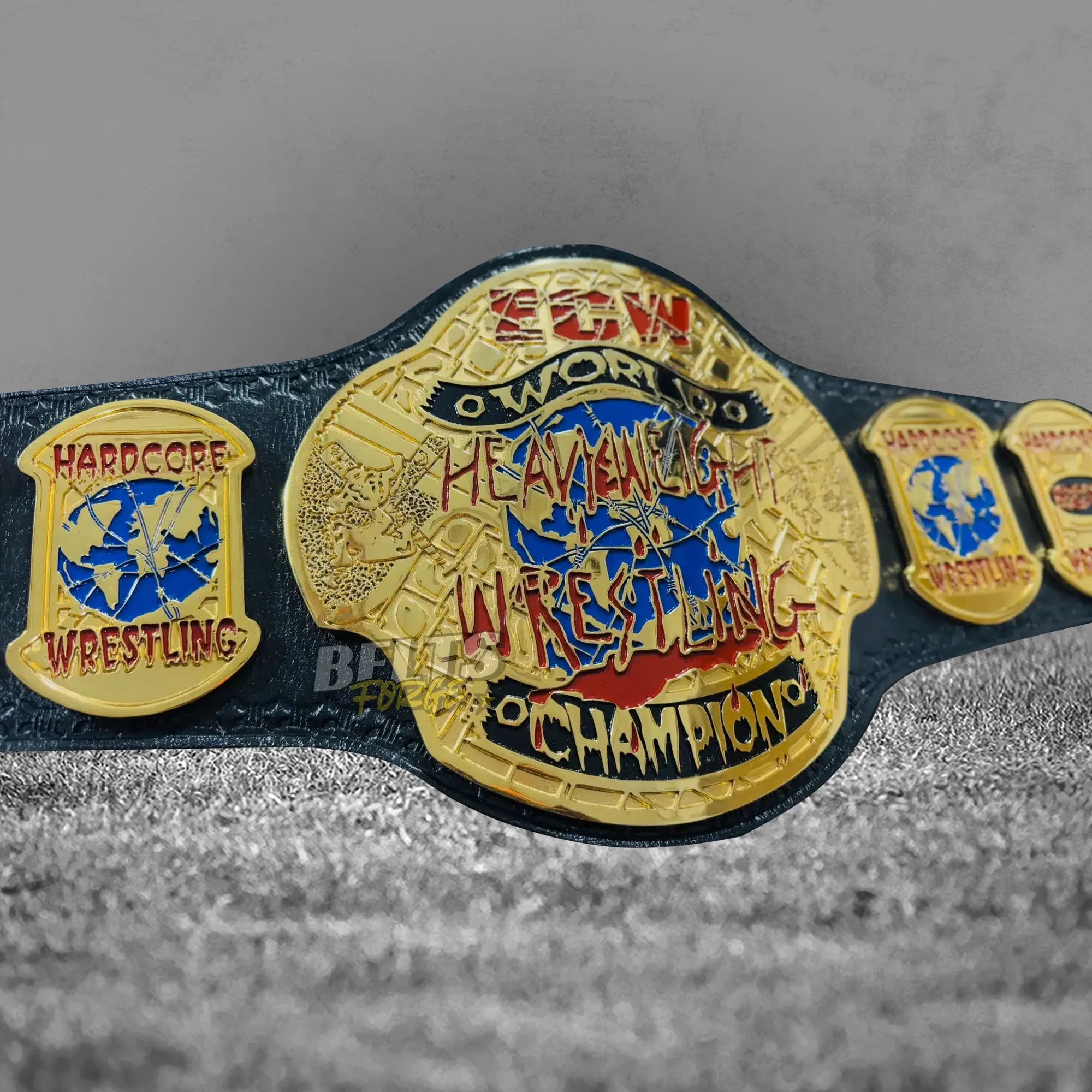ECW World Heavyweight Championship Belt center plate close-up showing CNC-engraved gold-plated brass ECW shield design