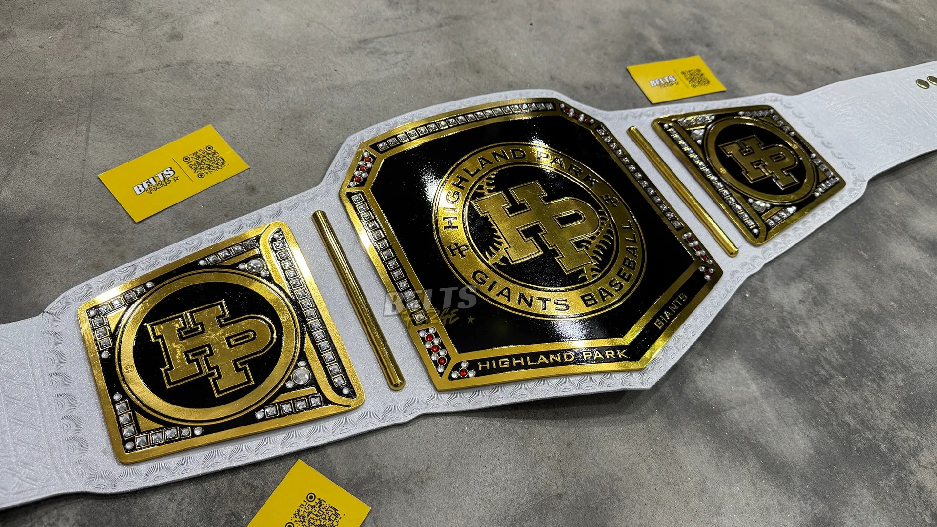 Highland Park Giants Baseball Championship Belt angled display view showing gold-plated brass plates and leather strap profile
