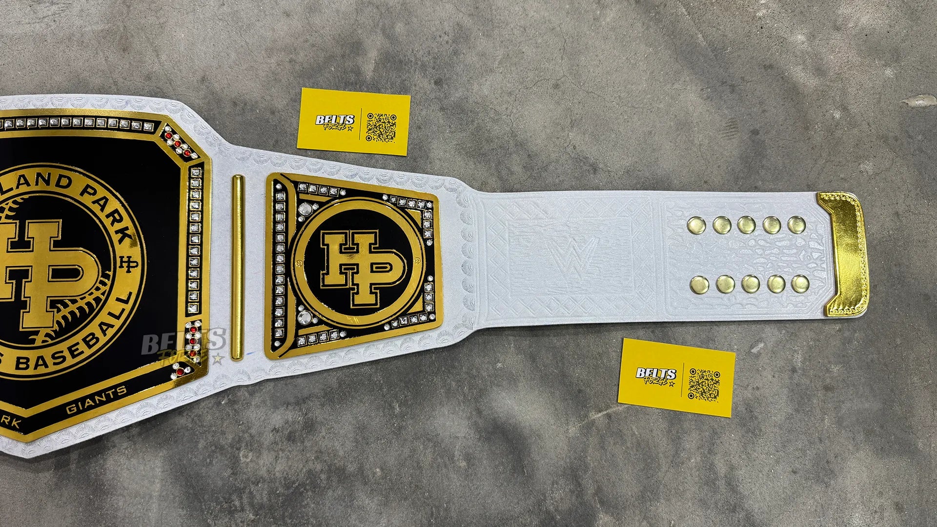 Highland Park Giants Baseball Championship Belt side plate and strap detail showing gold-plated brass plate on leather strap