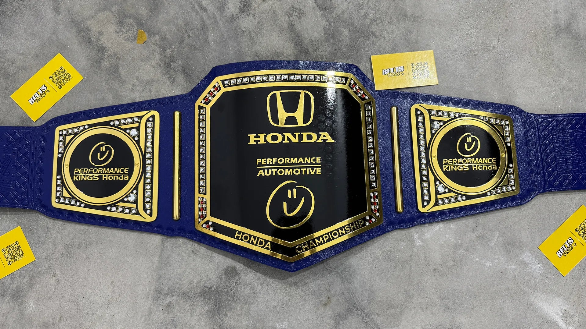 Honda Performance Kings Dealership Championship Belt front view, gold-plated brass main plate on genuine blue leather strap