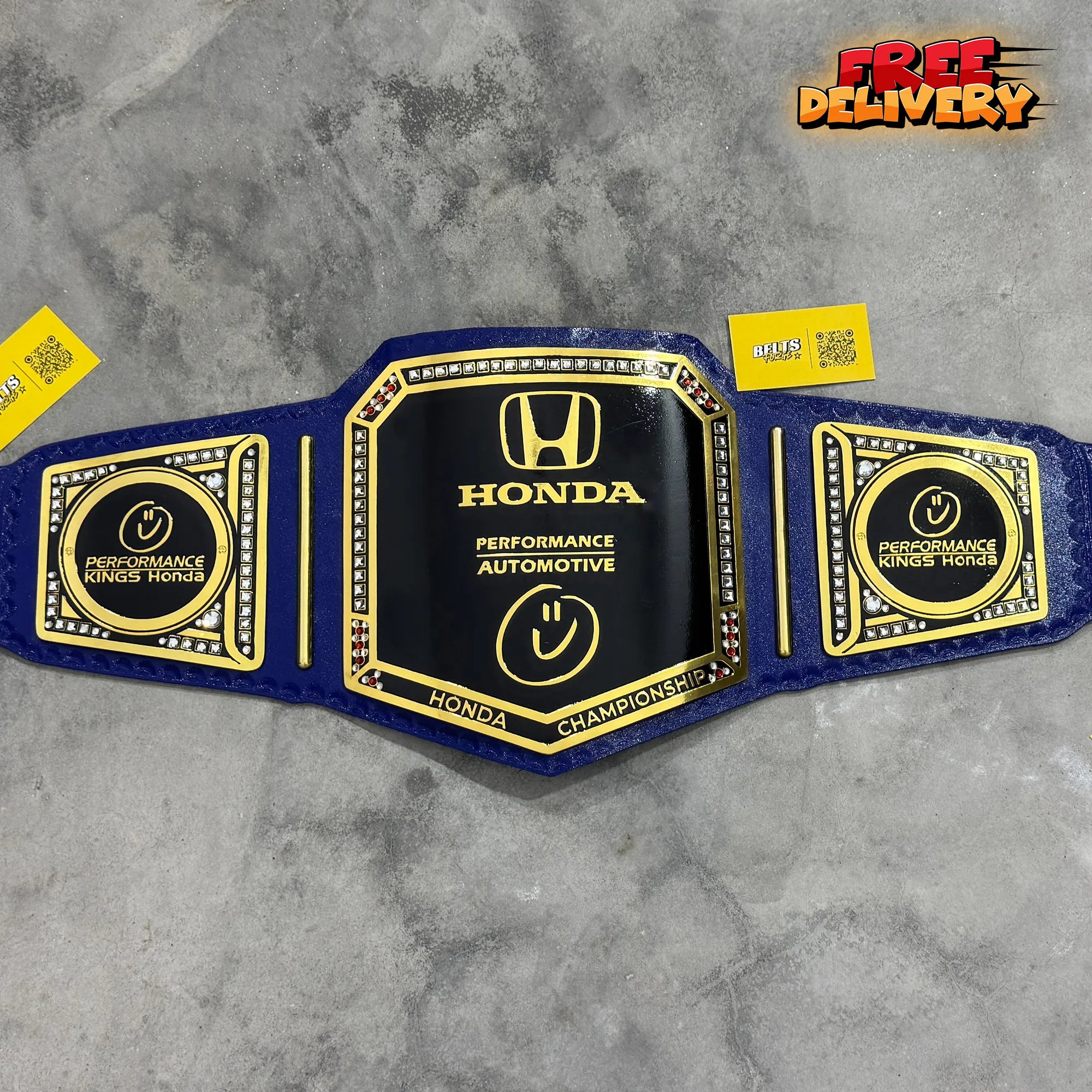 Honda Performance Kings Dealership Championship Belt promotional front view, gold-plated brass plates on genuine blue leather strap by Belts Forge