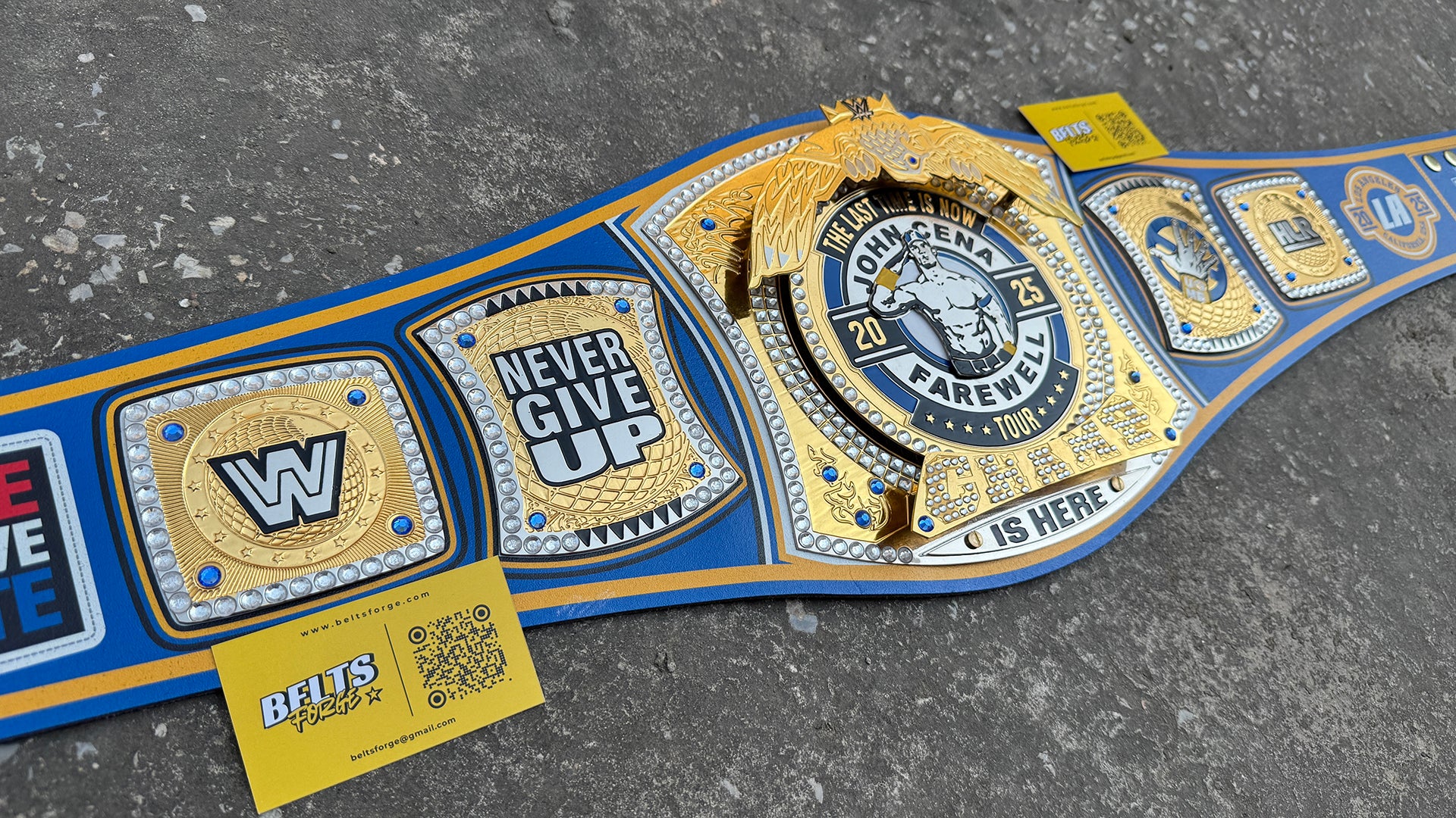 John Cena Farewell Tour LA 2025 Belt left angled view showing WW and Never Give Up side plates