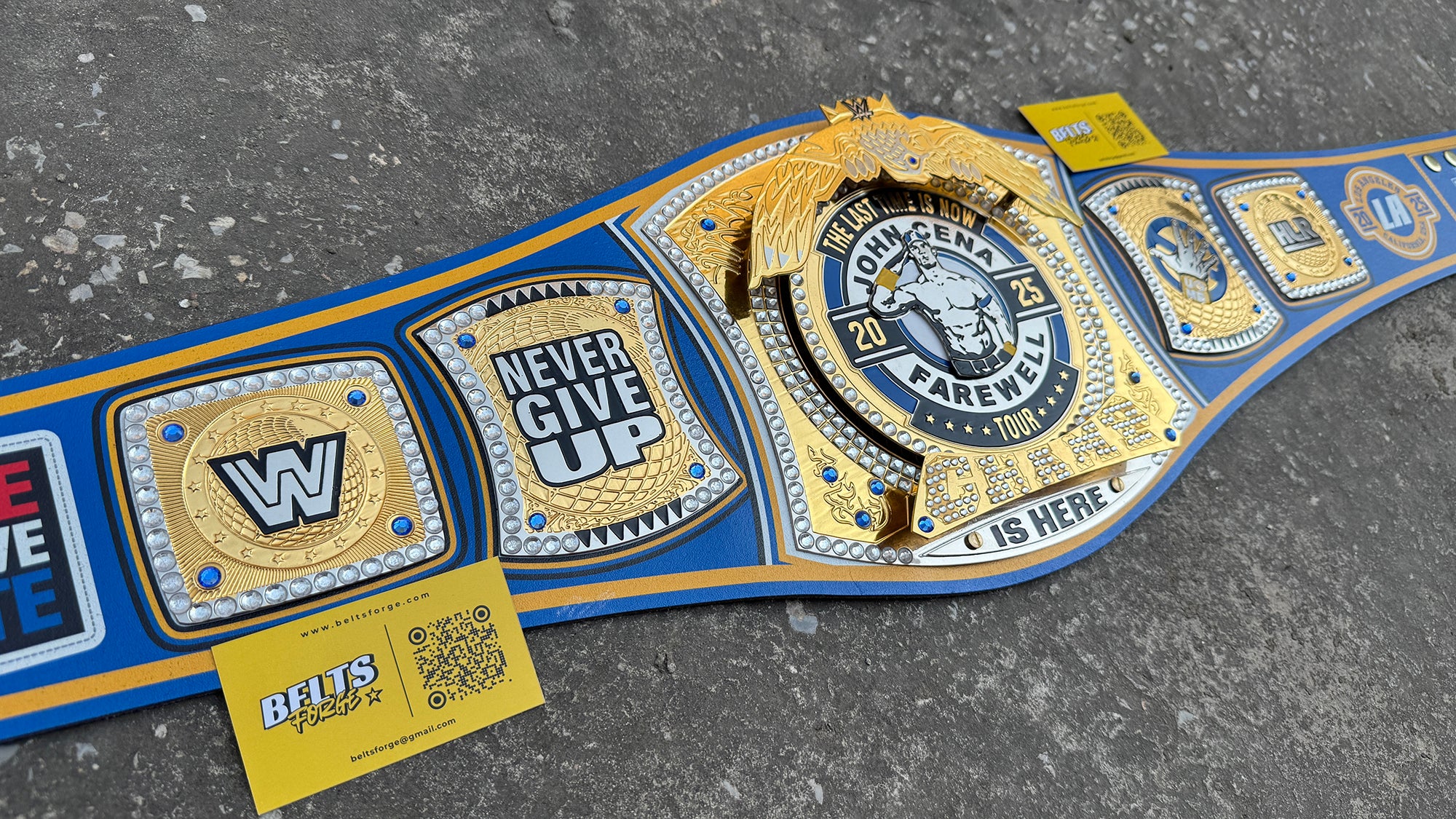 John Cena Farewell Tour championship belt center plate close-up, gold winged eagle crest with Farewell Tour 2025 enamel graphics