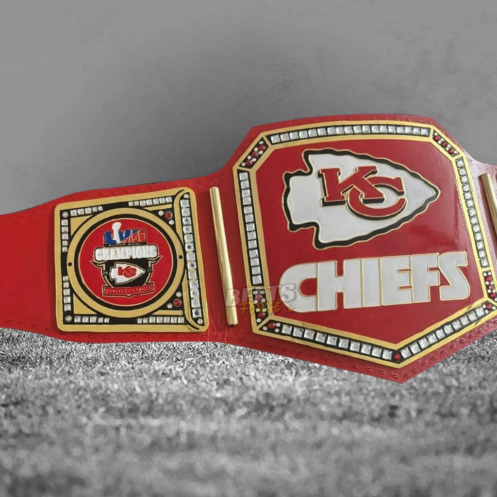 Kansas City Chiefs championship belt angled plate close-up showing CNC-engraved gold-plated brass Chiefs logo design