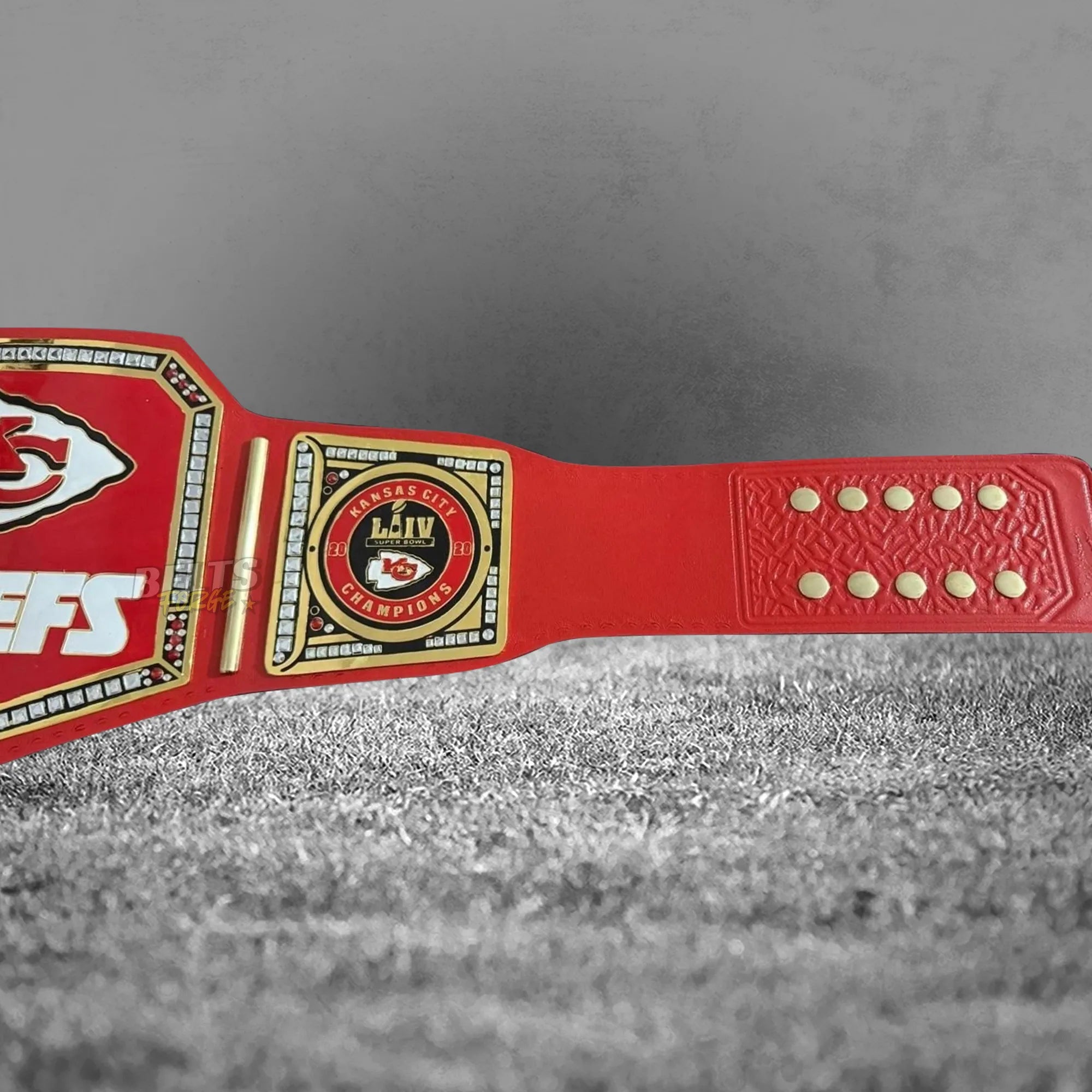 Kansas City Chiefs championship belt angled strap display view showing red printed leather strap and gold Chiefs plates profile