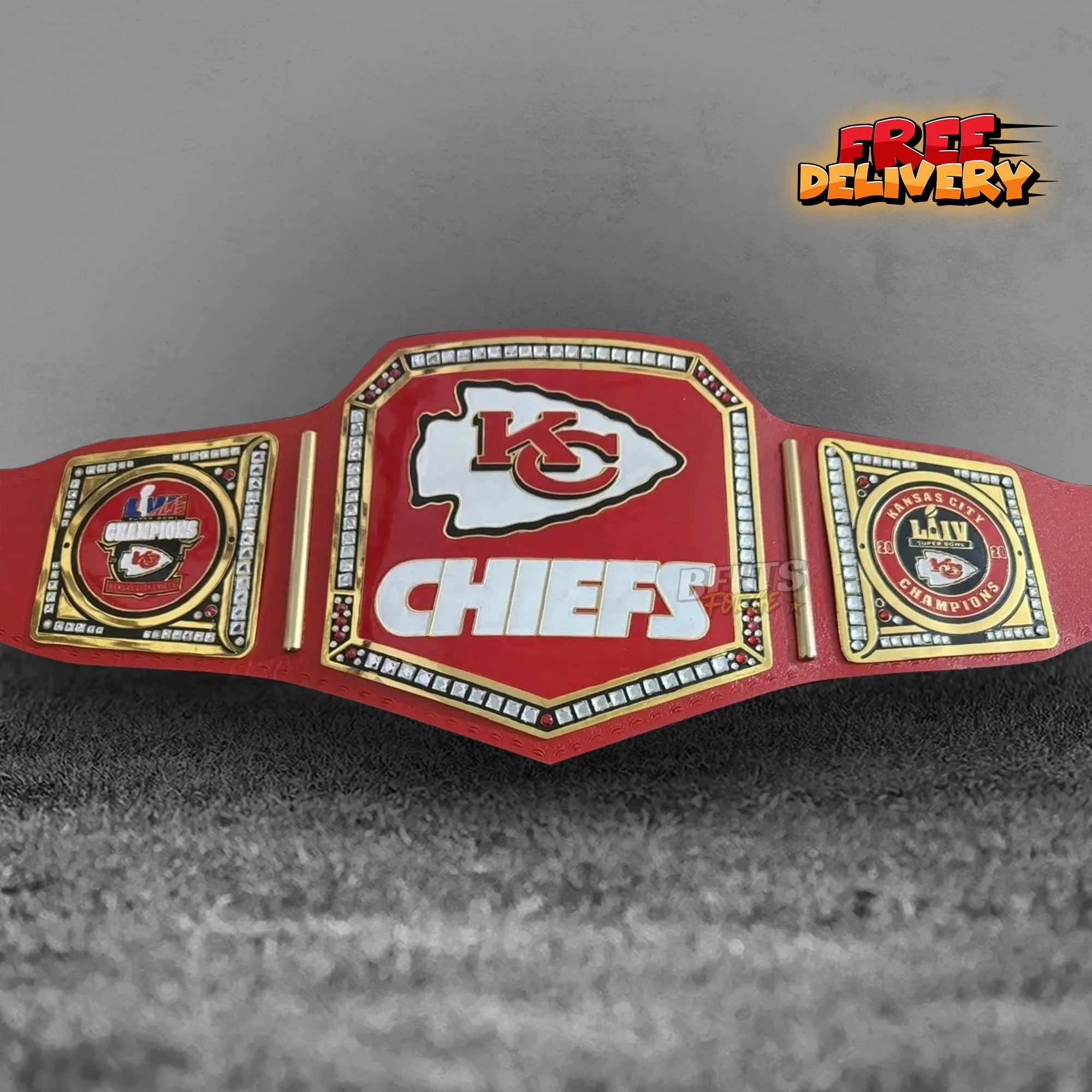 Kansas City Chiefs NFL Championship Belt replica front view, gold-plated brass Chiefs logo main plate on red printed leather strap by Belts Forge