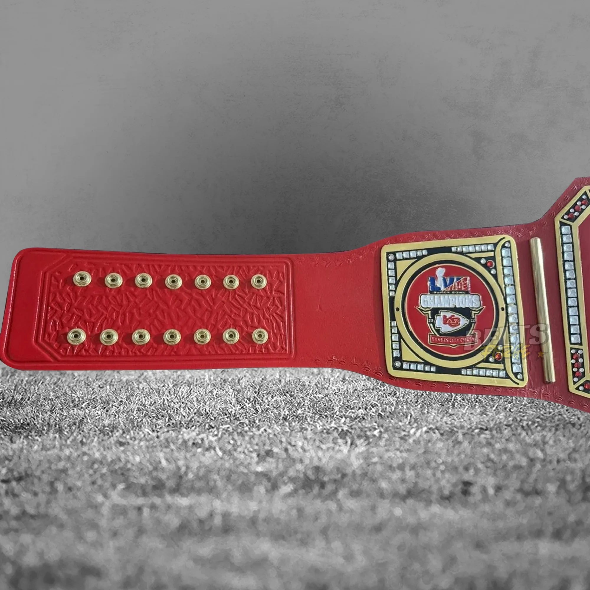 Kansas City Chiefs championship belt strap rivet and AFC side plate view showing gold hardware on genuine red printed leather
