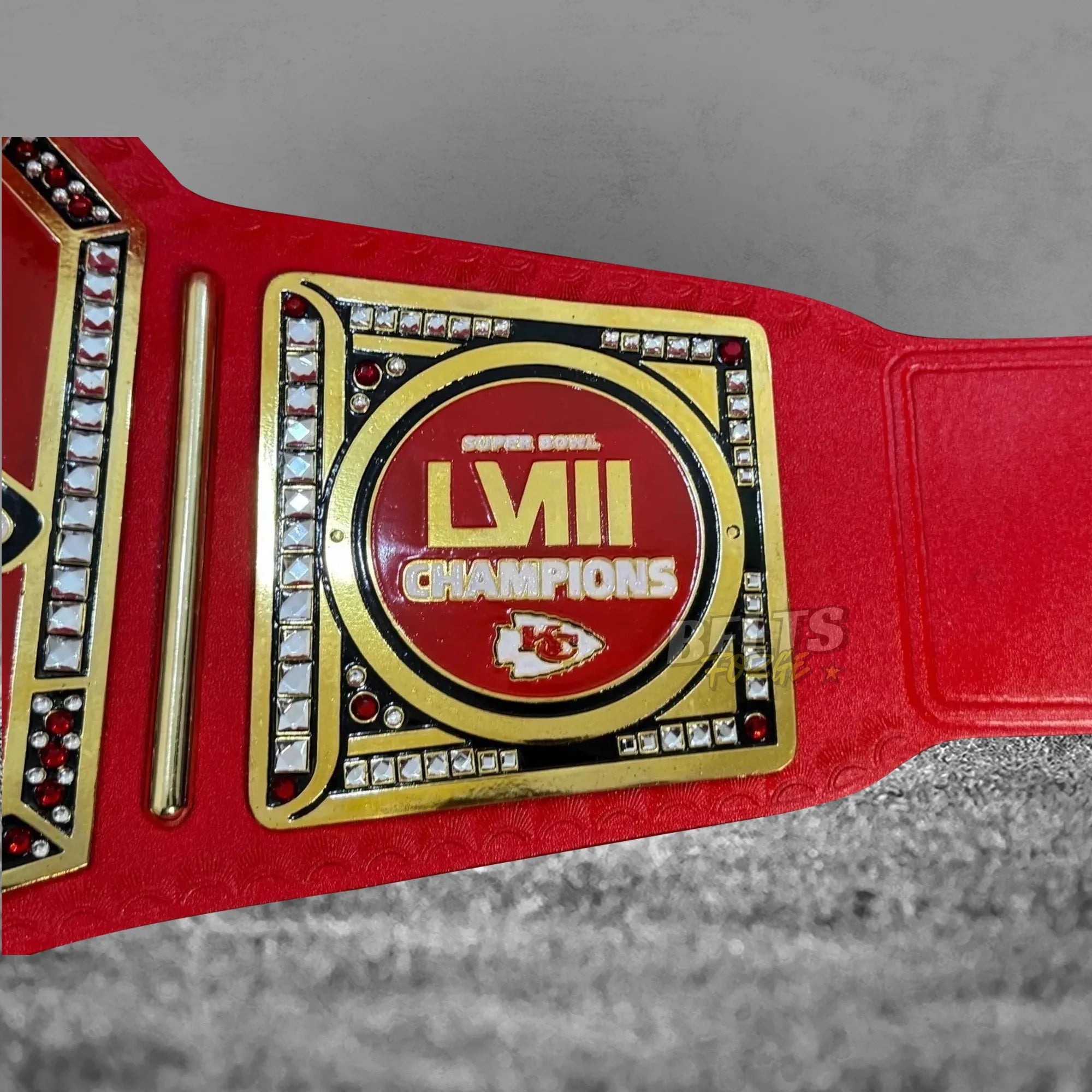 Kansas City Chiefs Super Bowl LVIII Championship Belt side plate close-up showing gold-plated brass LVIII commemorative plate detail