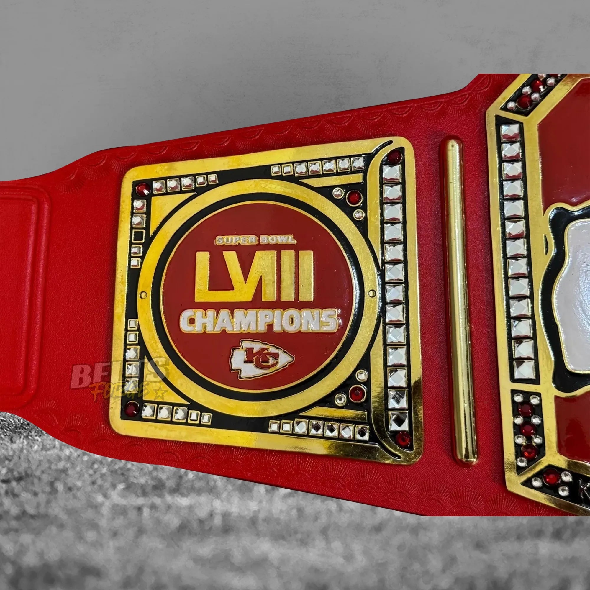 Kansas City Chiefs Super Bowl LVIII Championship Belt side plate detail showing gold-plated Super Bowl LVIII commemorative engraving on red leather