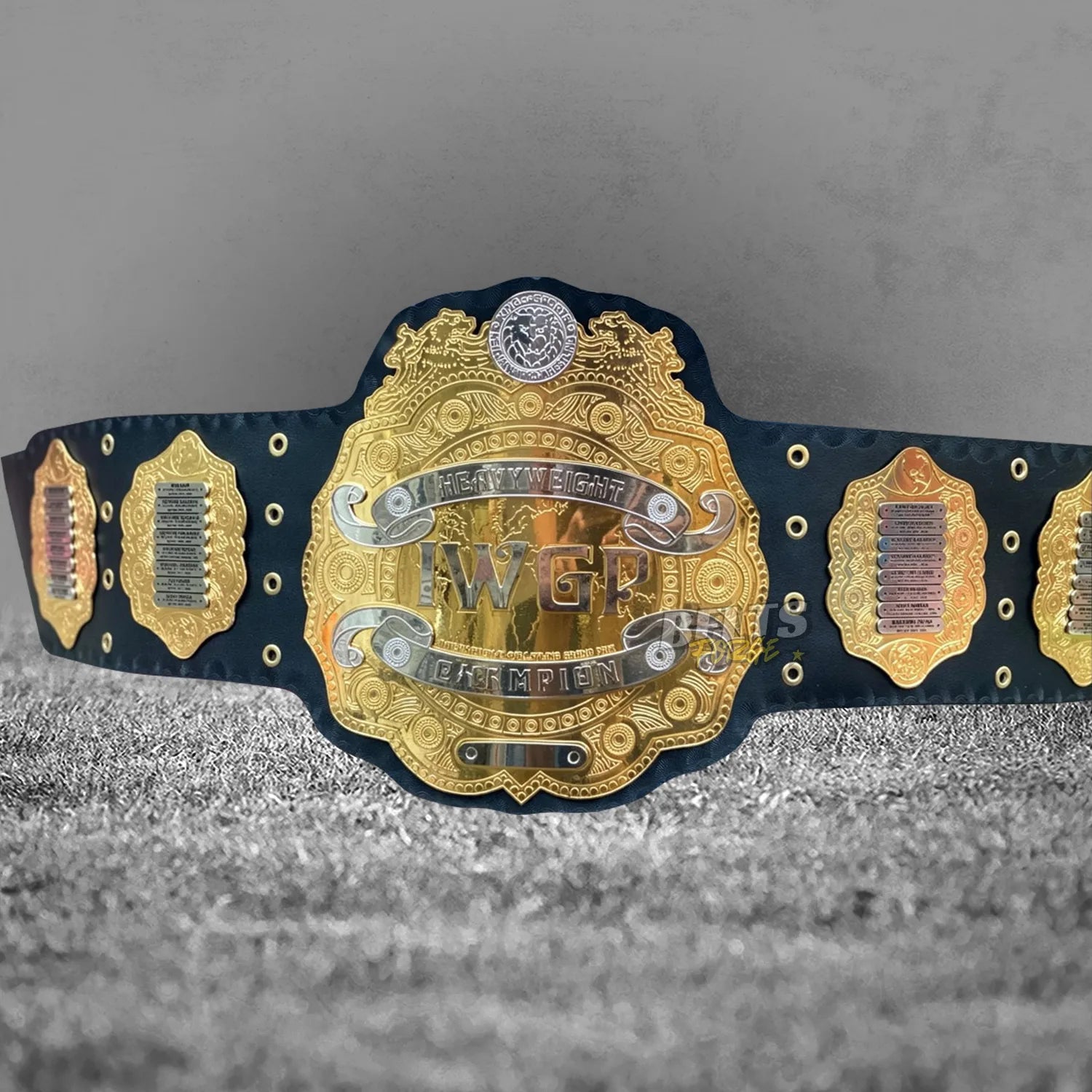 NJPW IWGP Heavyweight Championship Classic Belt full flat lay display view showing complete gold-plated plates on leather strap