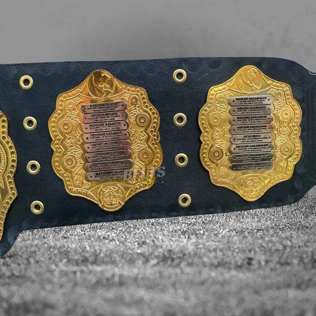 NJPW IWGP Heavyweight Championship Classic Belt left side plate detail showing engraved champions list on gold-plated brass