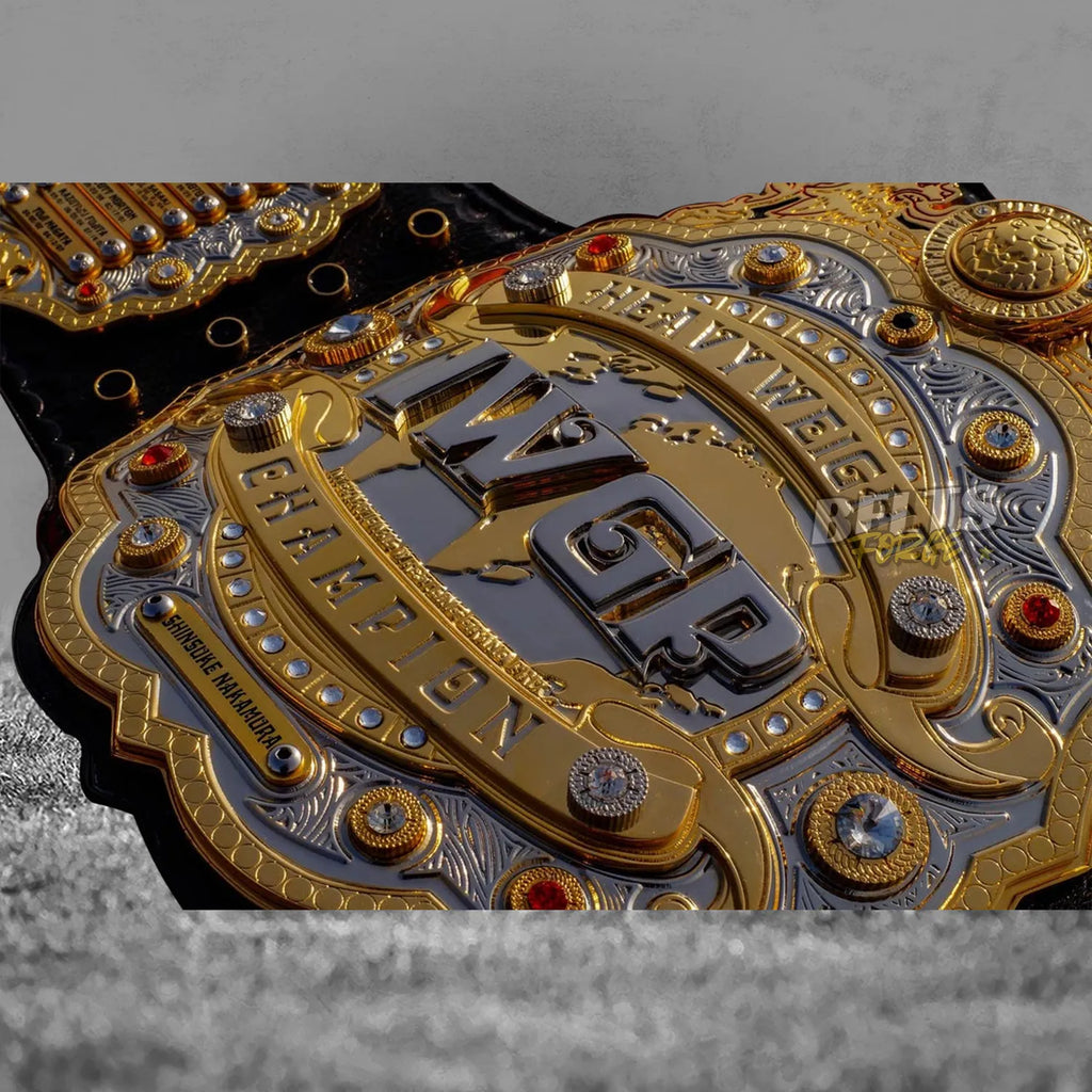 IWGP Heavyweight Championship V4 Belt center plate extreme close-up showing Nakamura nameplate and layered brass detail
