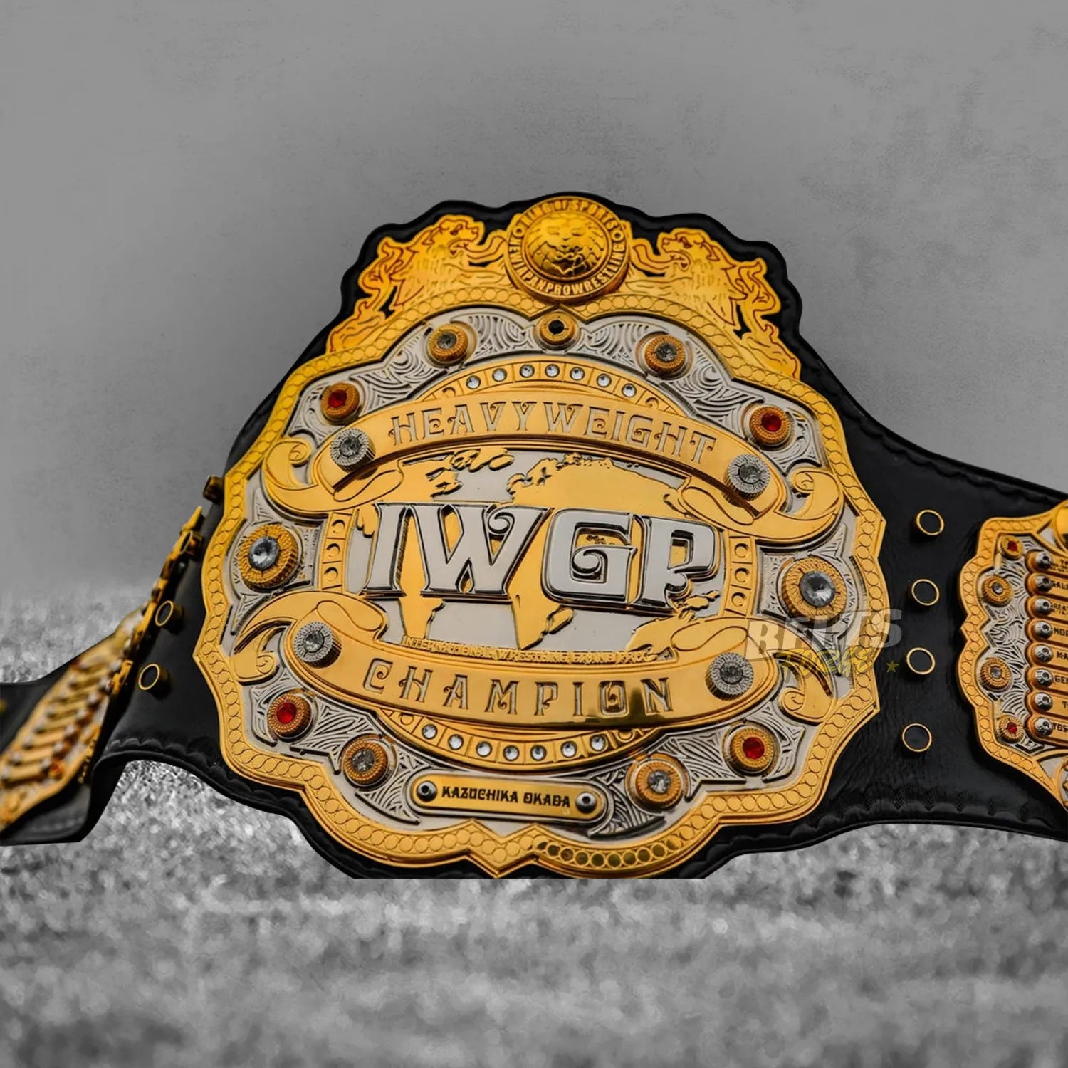 IWGP Heavyweight Championship V4 Belt center plate overhead close-up showing 4 layer CNC machined detail and depth