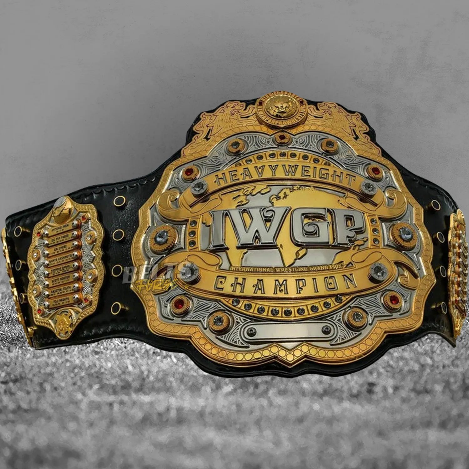 IWGP Heavyweight Championship V4 Belt replica front display angled view showing 4 layer CNC machined brass plates on leather strap