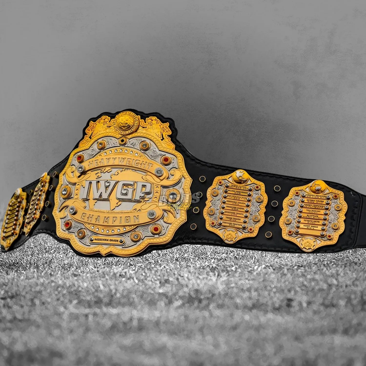 IWGP Heavyweight Championship V4 Belt full flat lay display view showing complete gold-plated brass plates on leather strap