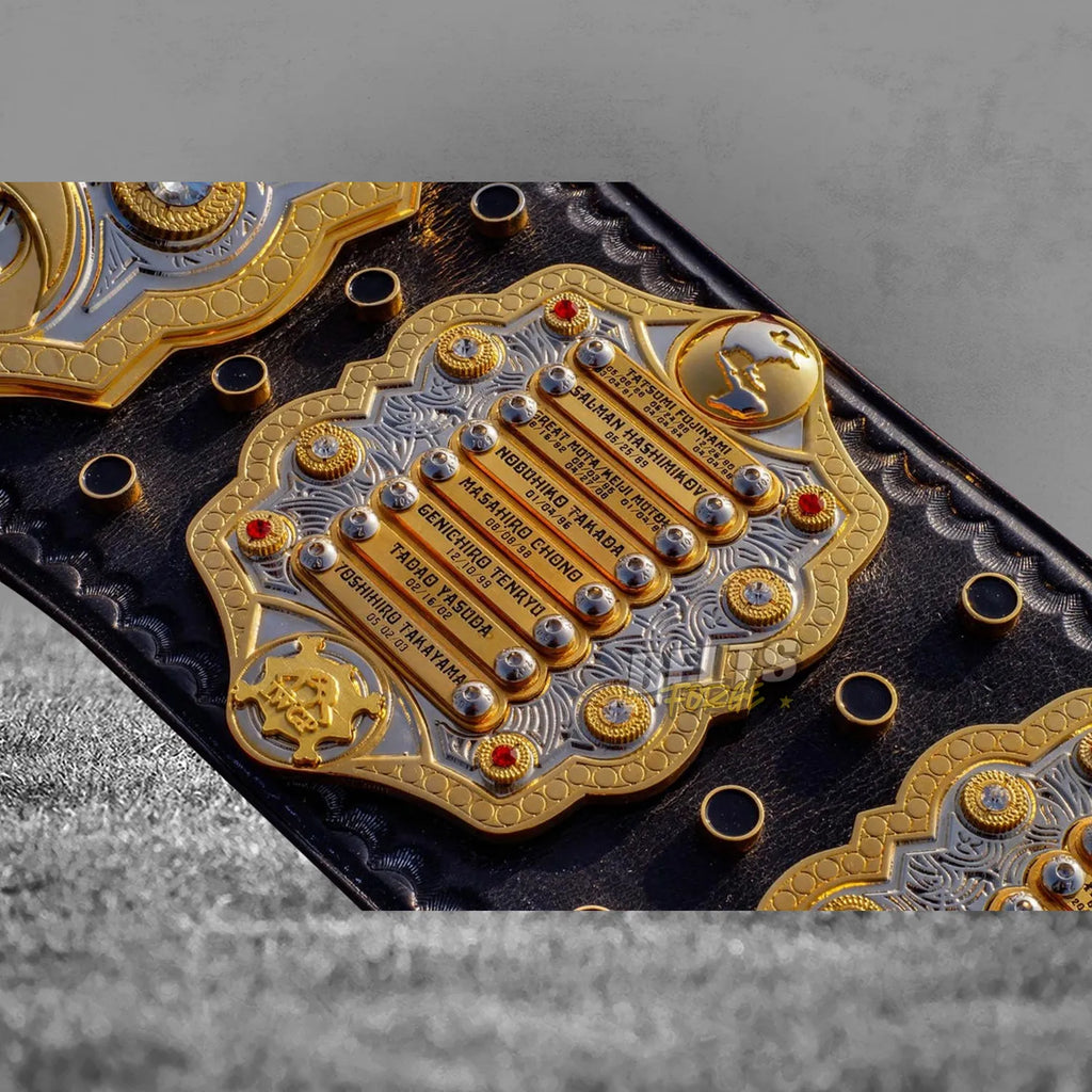 IWGP Heavyweight Championship V4 Belt right side plate showing engraved champions list close-up on gold-plated brass