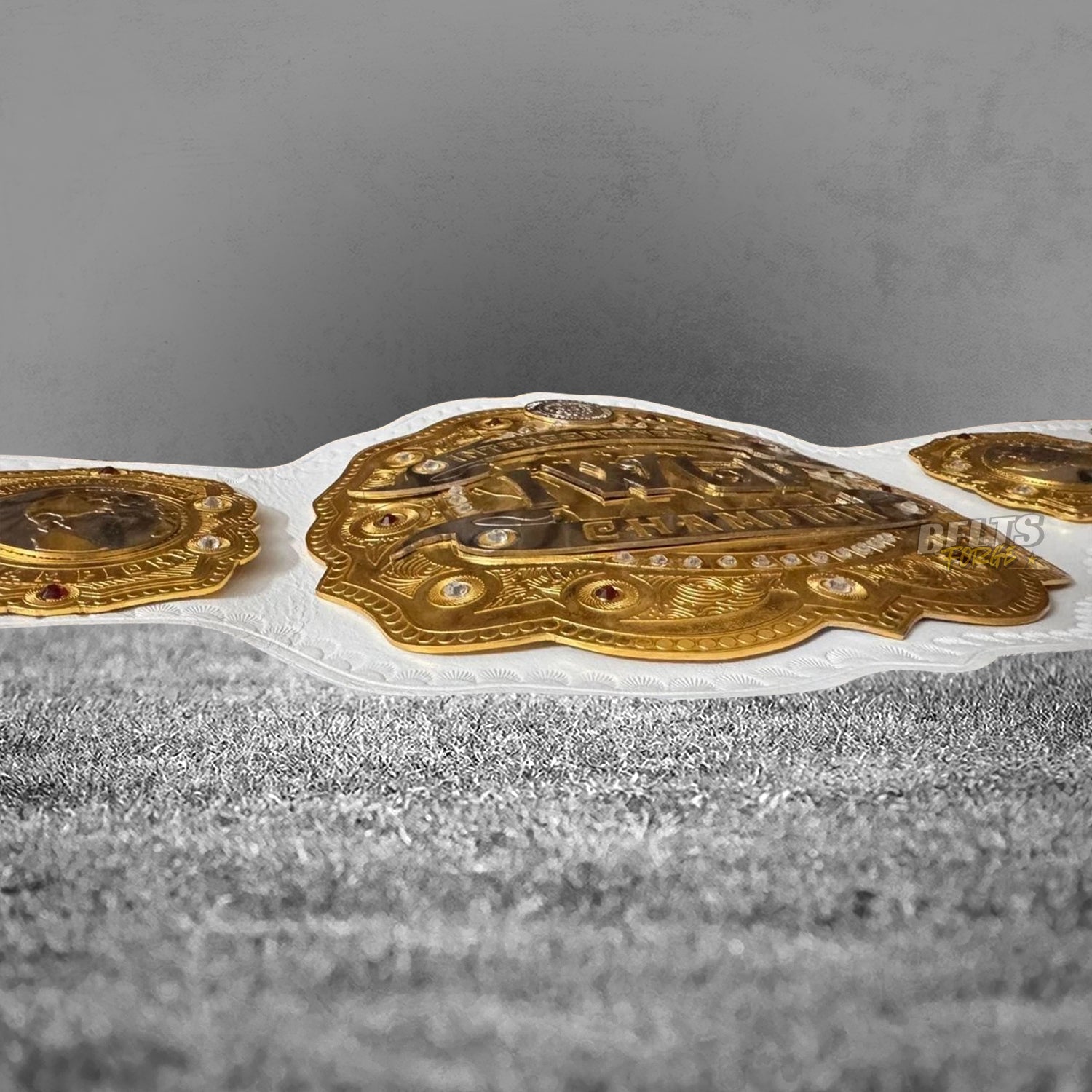 NJPW IWGP Intercontinental Championship Belt angled profile view showing full gold-plated brass plates on genuine white leather strap
