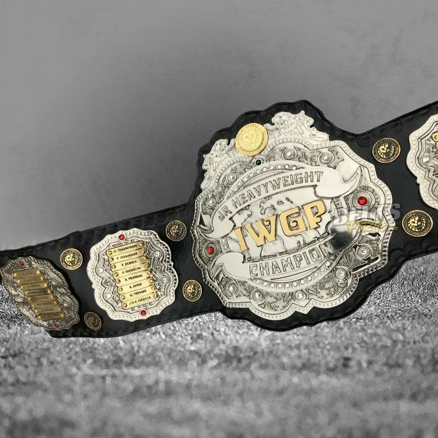 NJPW IWGP Junior Heavyweight Championship Belt front display view with left side plates showing full gold-plated brass arrangement