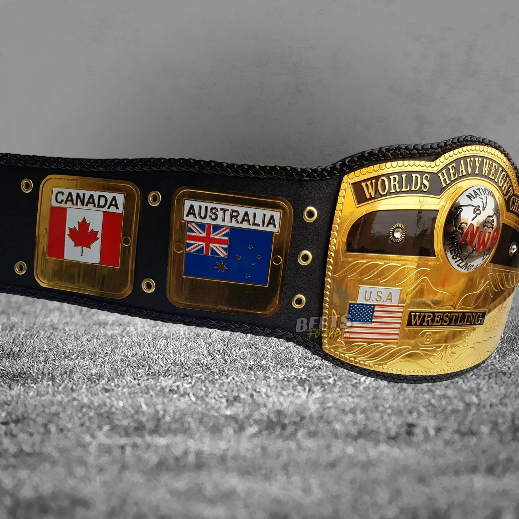 NWA World's Heavyweight Championship Belt left angled view showing center plate and Canada and Australia flag side plates