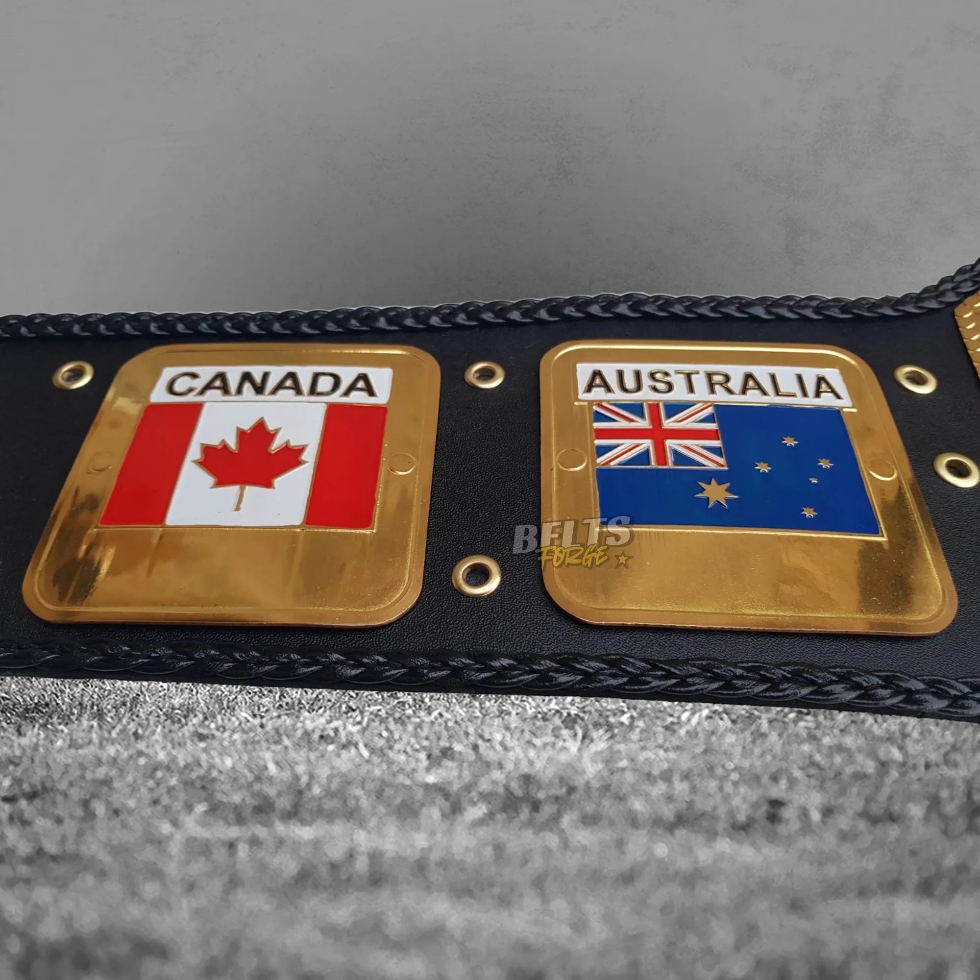 NWA World's Heavyweight Championship Belt left strap detail showing Canada and Australia flag side plates on genuine leather