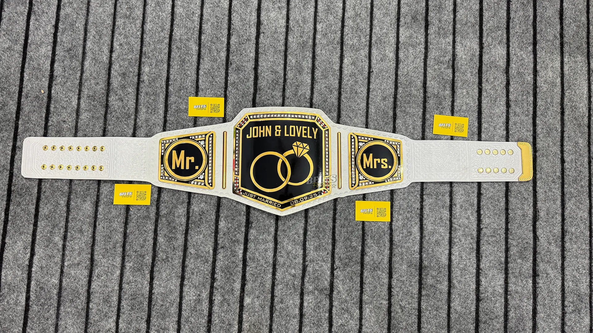 Just Married Mr and Mrs Wedding Championship Belt full flat lay display view showing complete gold plates on white leather strap