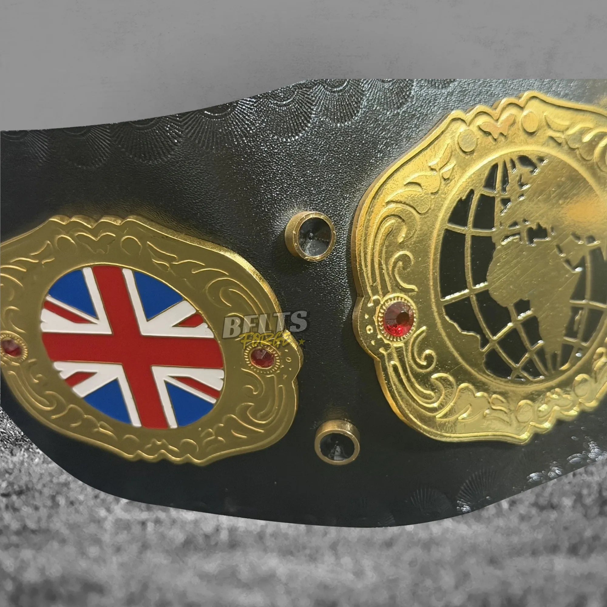British Heavyweight Championship Belt close-up showing Union Jack and globe side plates detail