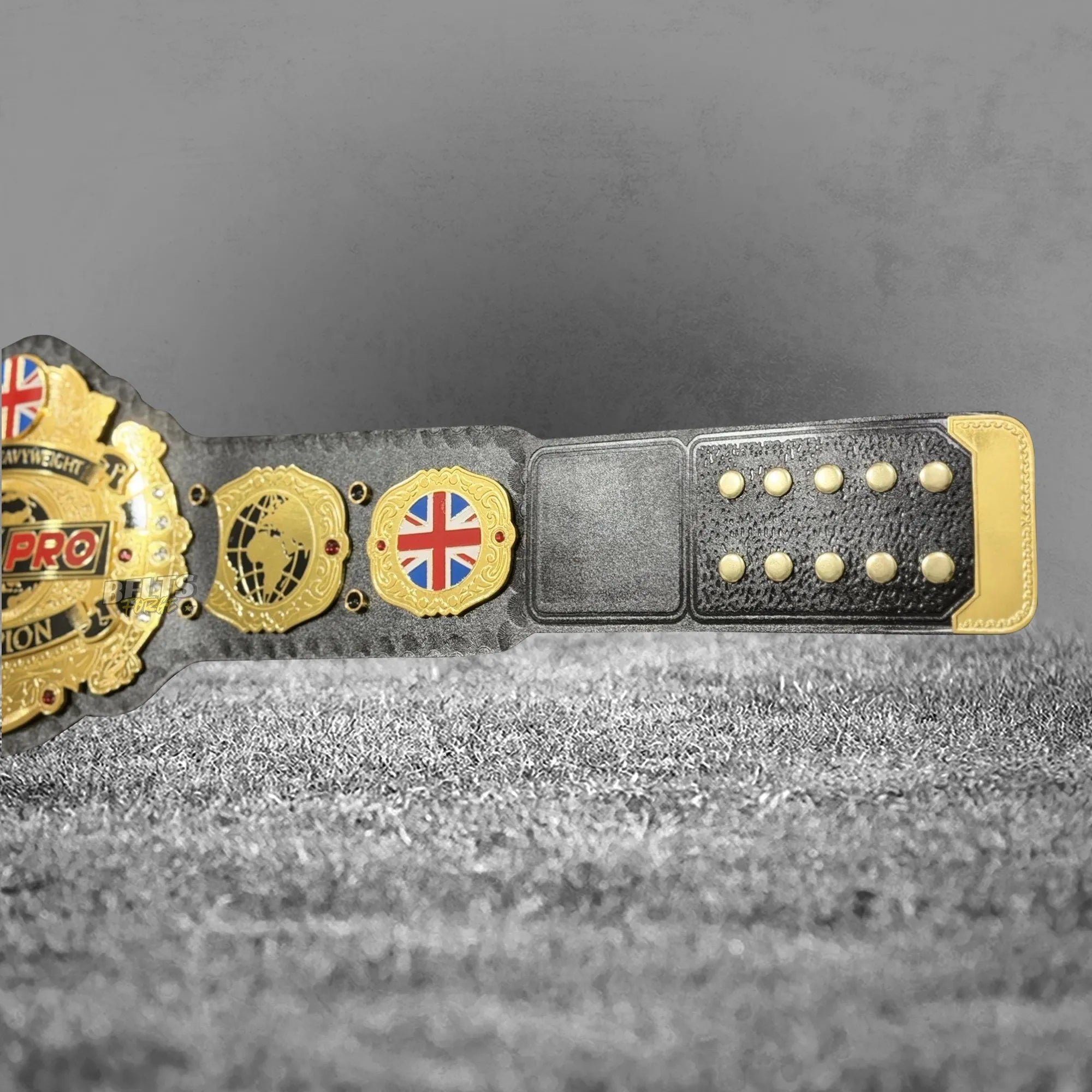 British Heavyweight Championship Belt left strap buckle end showing Union Jack and globe side plates