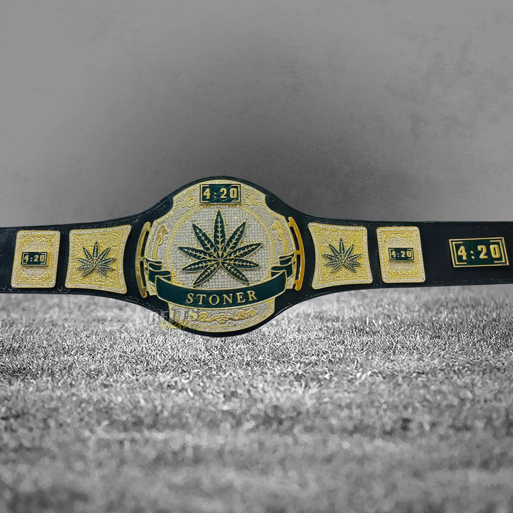 Stoner 420 Championship Novelty Belt side plates close-up showing gold-plated brass novelty side plates on black leather strap