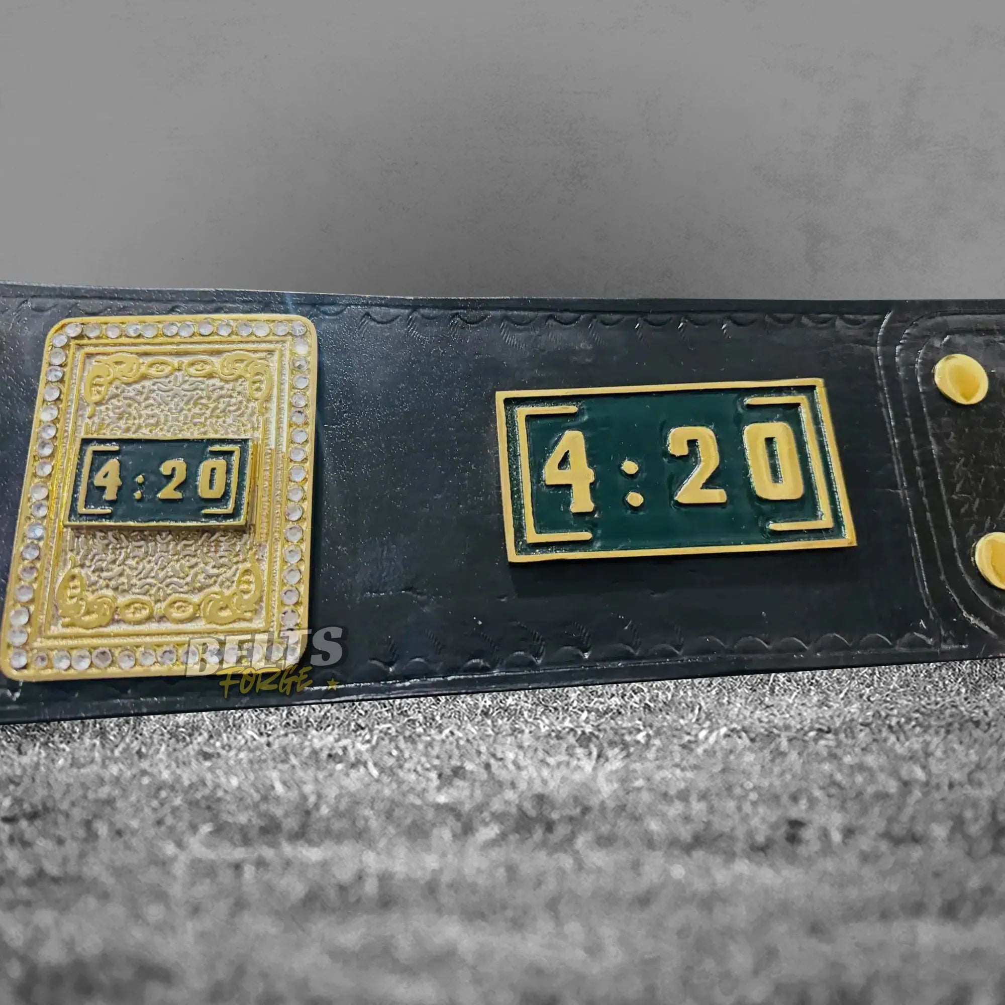 Stoner 420 Championship Novelty Belt strap and plate close-up showing gold hardware and genuine leather strap detail