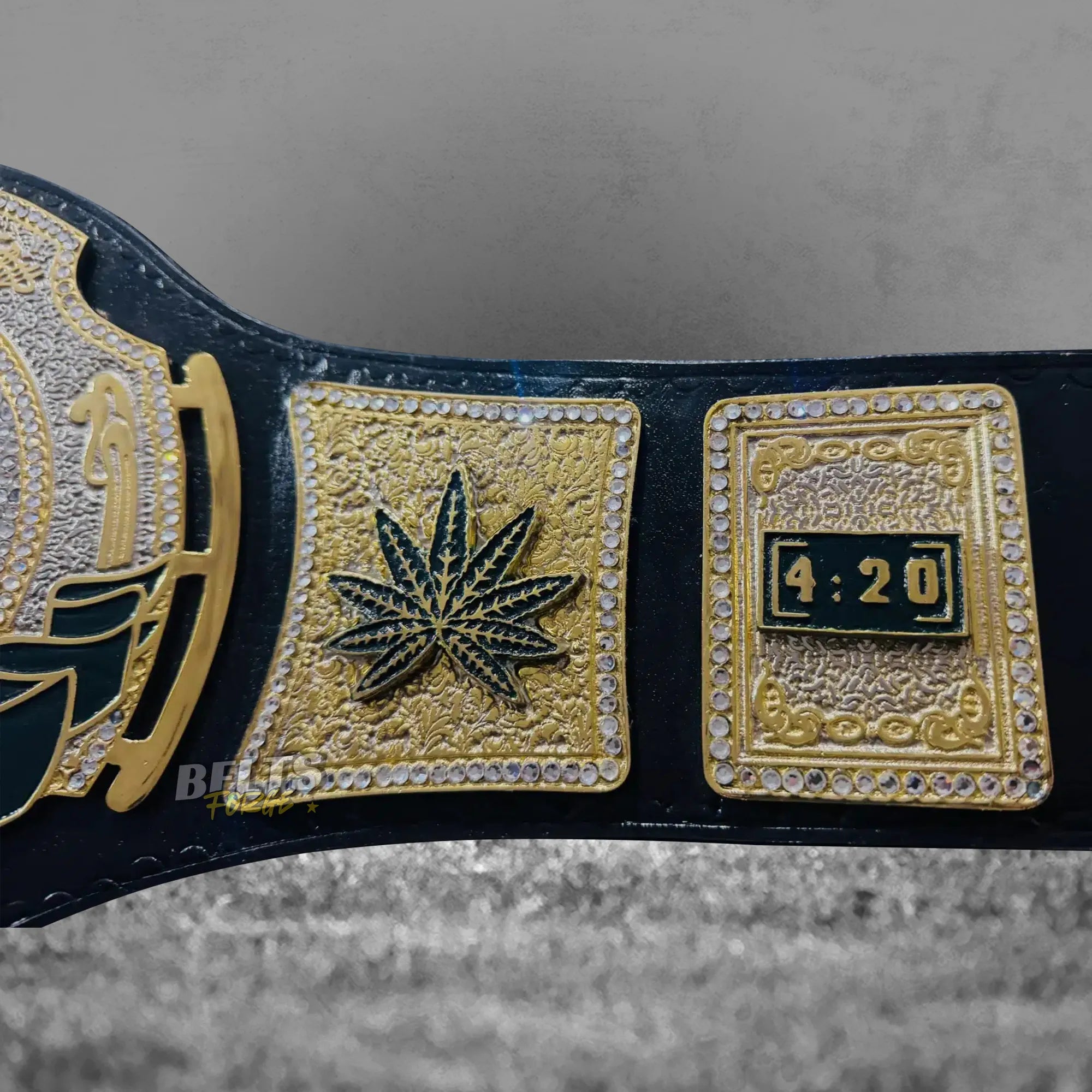 Stoner 420 Championship Novelty Belt strap rivet detail showing gold hardware studs on genuine black leather strap close-up