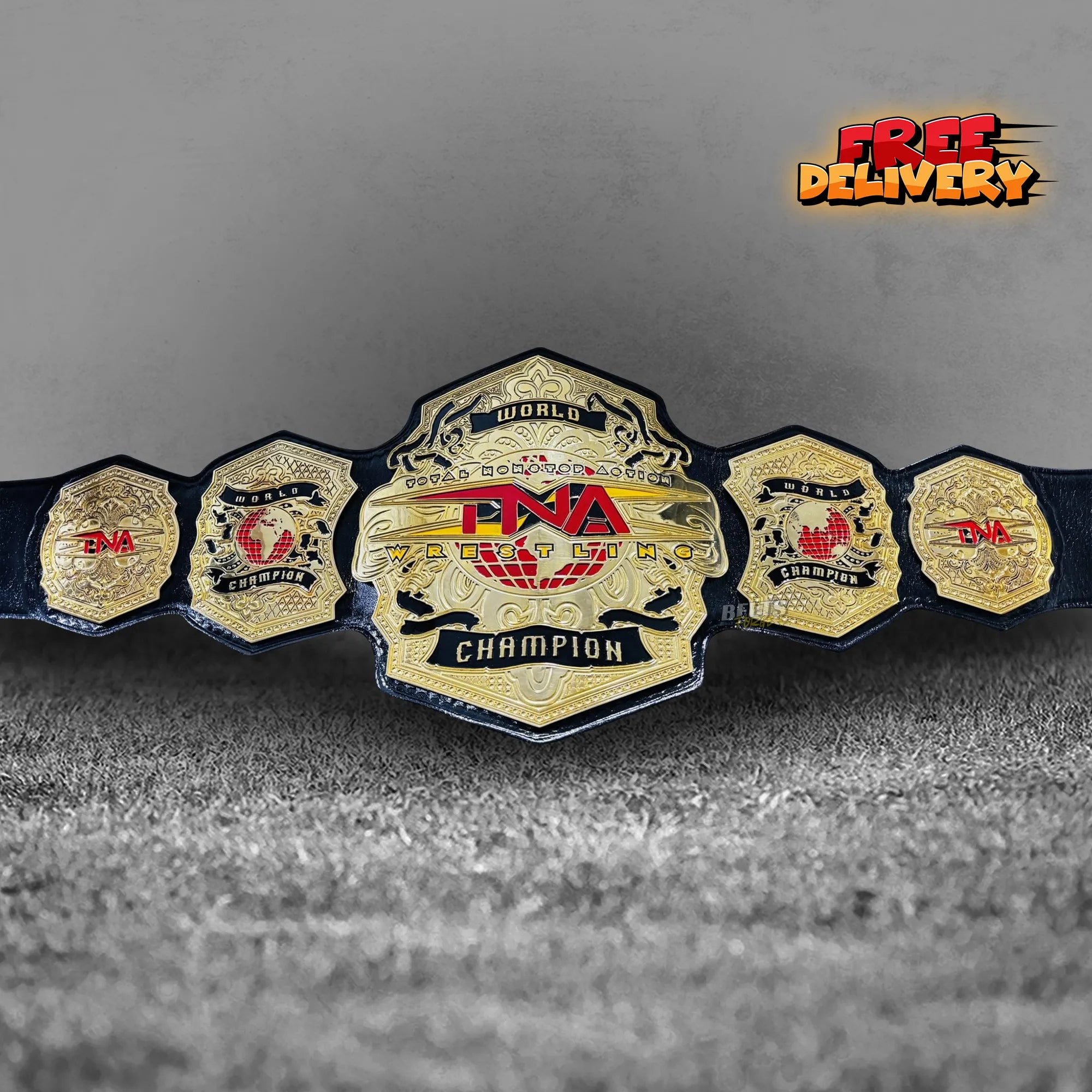 TNA World Heavyweight Championship Belt replica front view, gold-plated brass TNA globe main plate on genuine black leather strap by Belts Forge