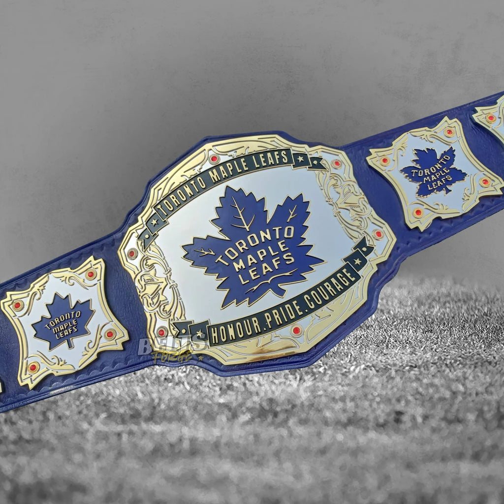 Toronto Maple Leafs championship belt center plate close-up showing CNC-engraved gold-plated brass Maple Leafs logo design