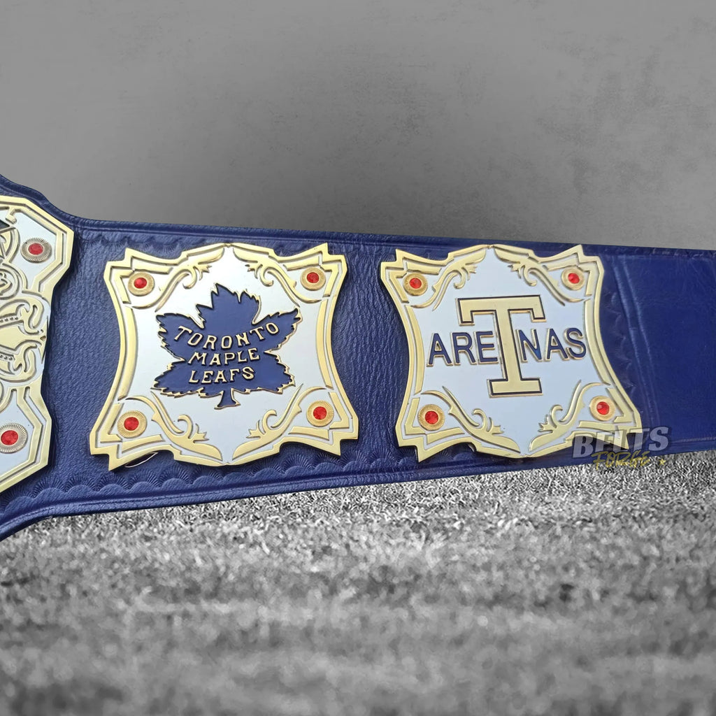Toronto Maple Leafs championship belt Arenas heritage side plate detail showing gold-plated brass heritage plate on blue leather