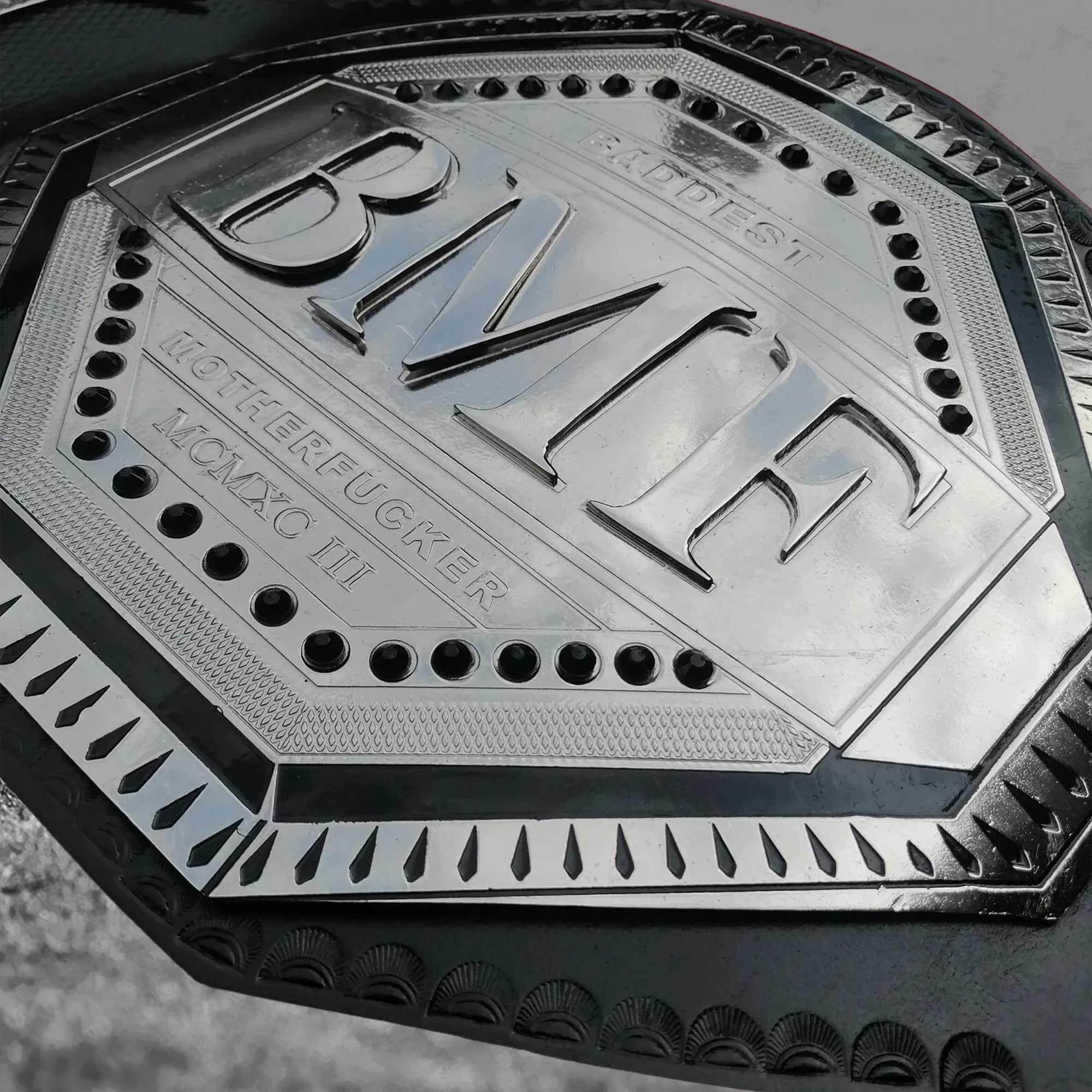 UFC BMF Championship Belt replica alternate center plate detail showing gold-plated brass BMF octagon design and engraving