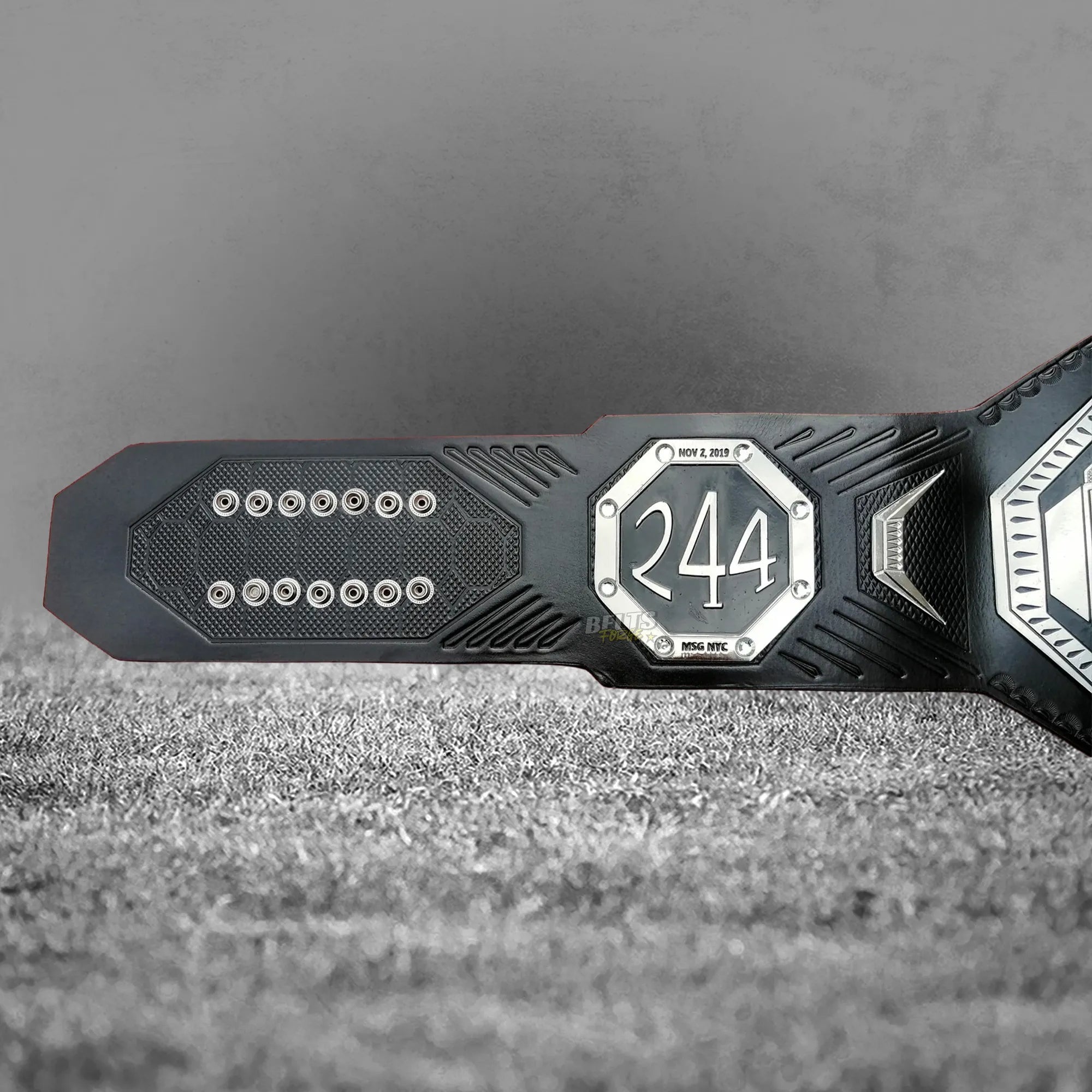 UFC BMF Championship Belt UFC 244 commemorative side plate detail on genuine cowhide leather strap with carbon emboss