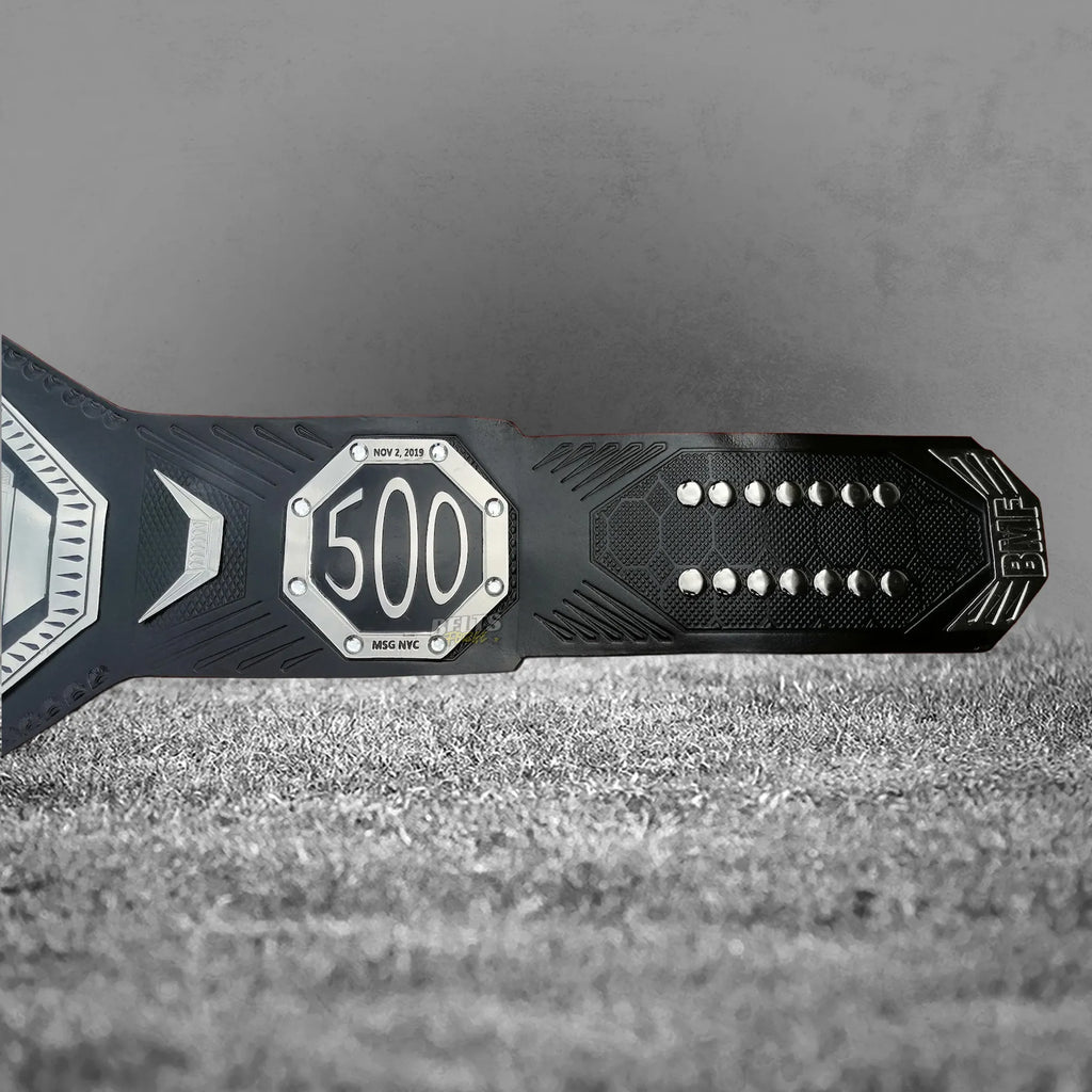 UFC BMF Championship Belt UFC 500 commemorative side plate detail showing gold-plated octagon engraving on leather strap