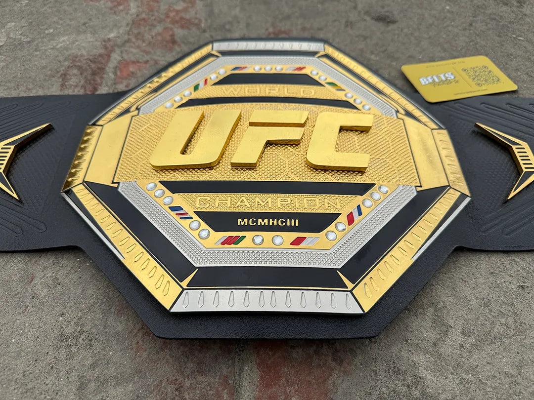 UFC Legacy Championship Belt center plate front face, gold champion engraving and MCMHCIII inscription detail