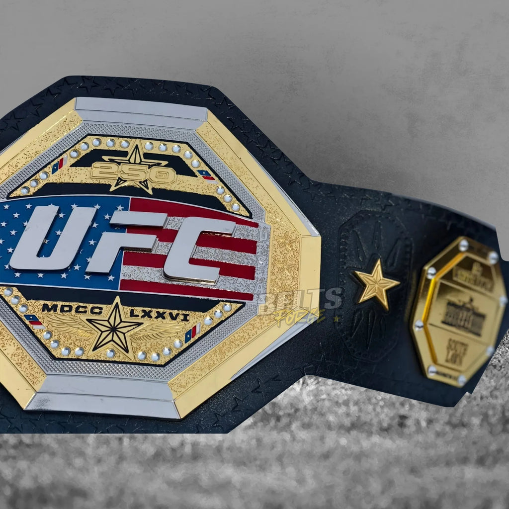 UFC Freedom 250 Championship Belt angled center plate view showing gold octagon engraving and rhinestone detail from angle