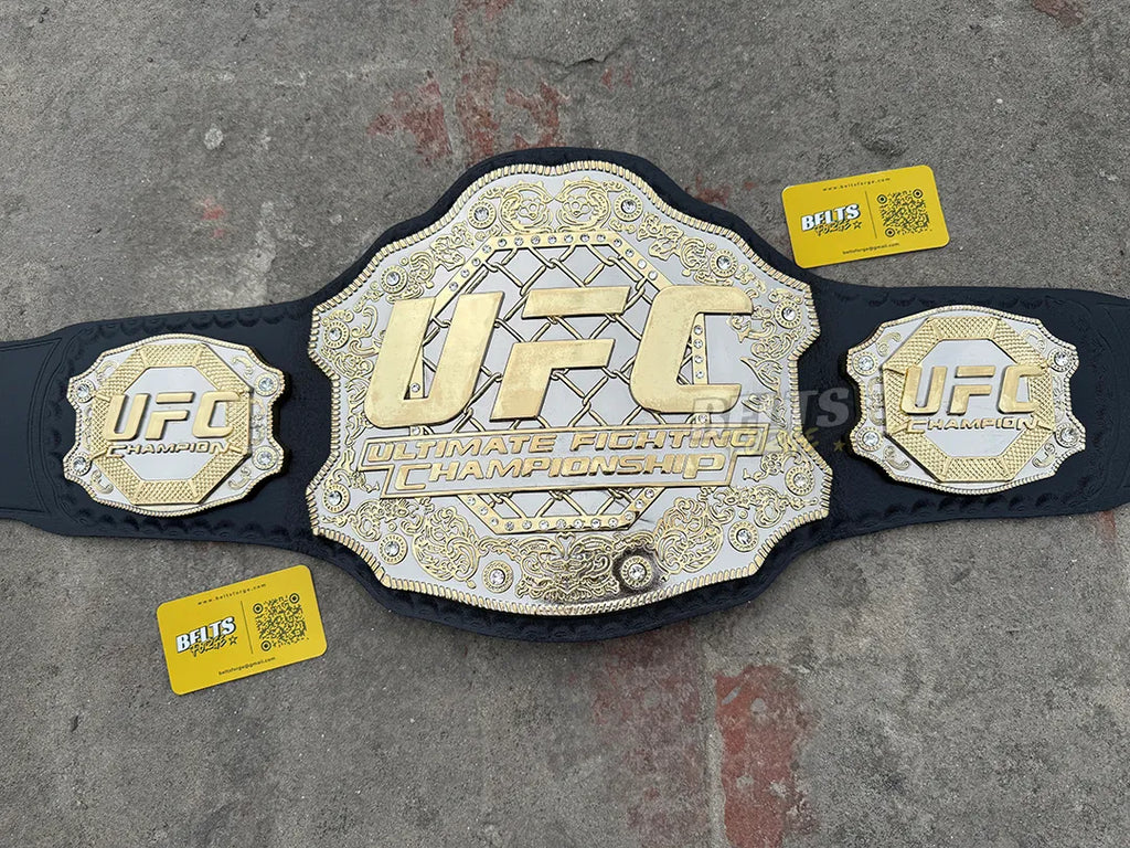 UFC Classic Championship Belt center plate close-up, CNC-engraved silver chain-link pattern and gold filigree border