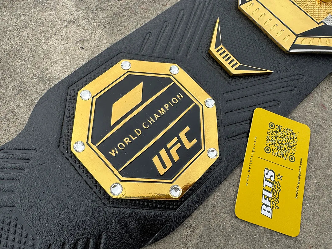 UFC Legacy Championship Belt left side plate macro shot, gold octagon engraved UFC logo close-up